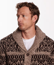 Man wearing a shawl collar sweater jacket in mocha with a textured knit pattern, featuring a button closure.