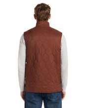 Back view of a man wearing a Hexagon Quilted Lightweight Vest in Cappuccino, showcasing its stylish design and functionality.