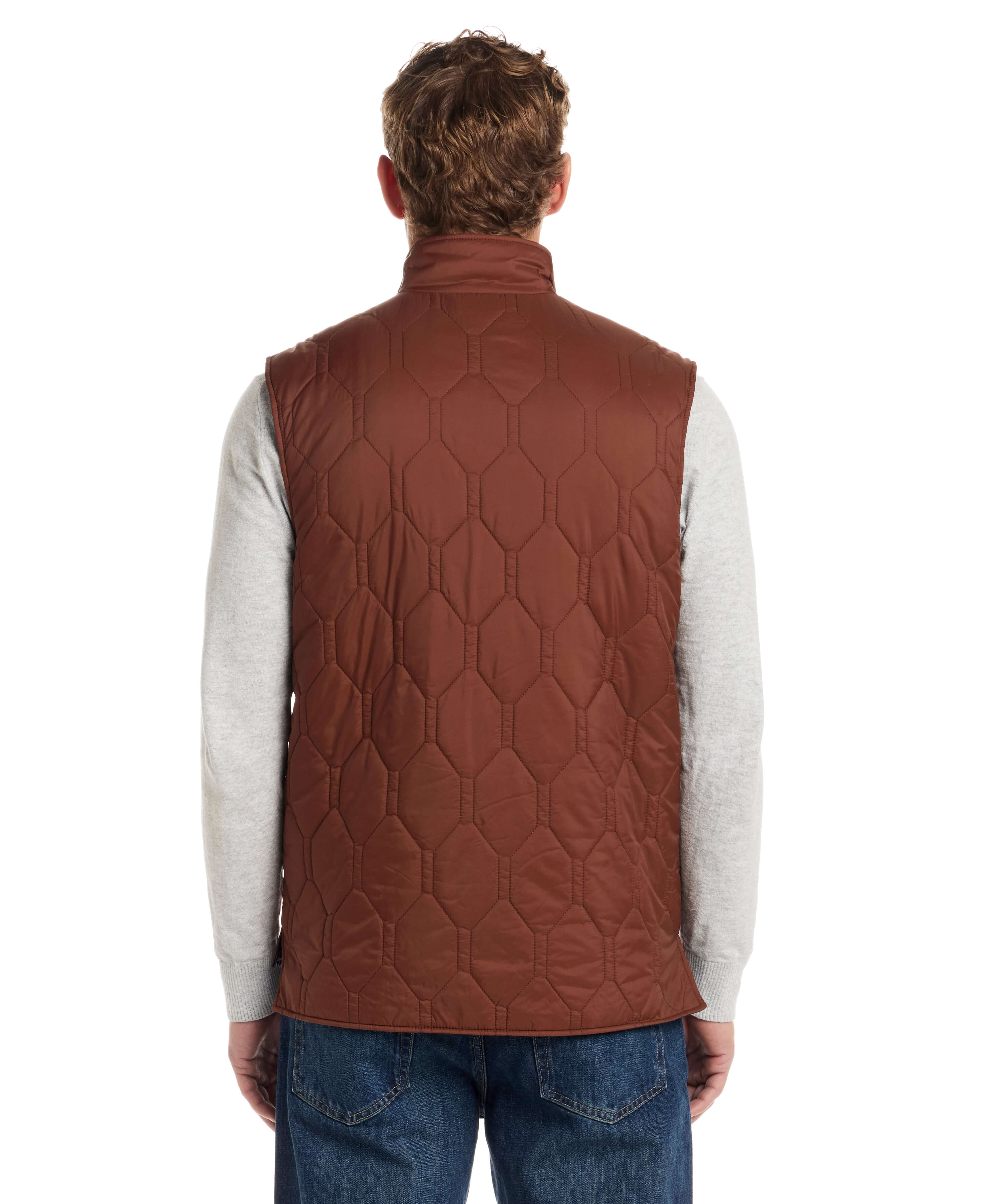 Back view of a man wearing a Hexagon Quilted Lightweight Vest in Cappuccino, showcasing its stylish design and functionality.