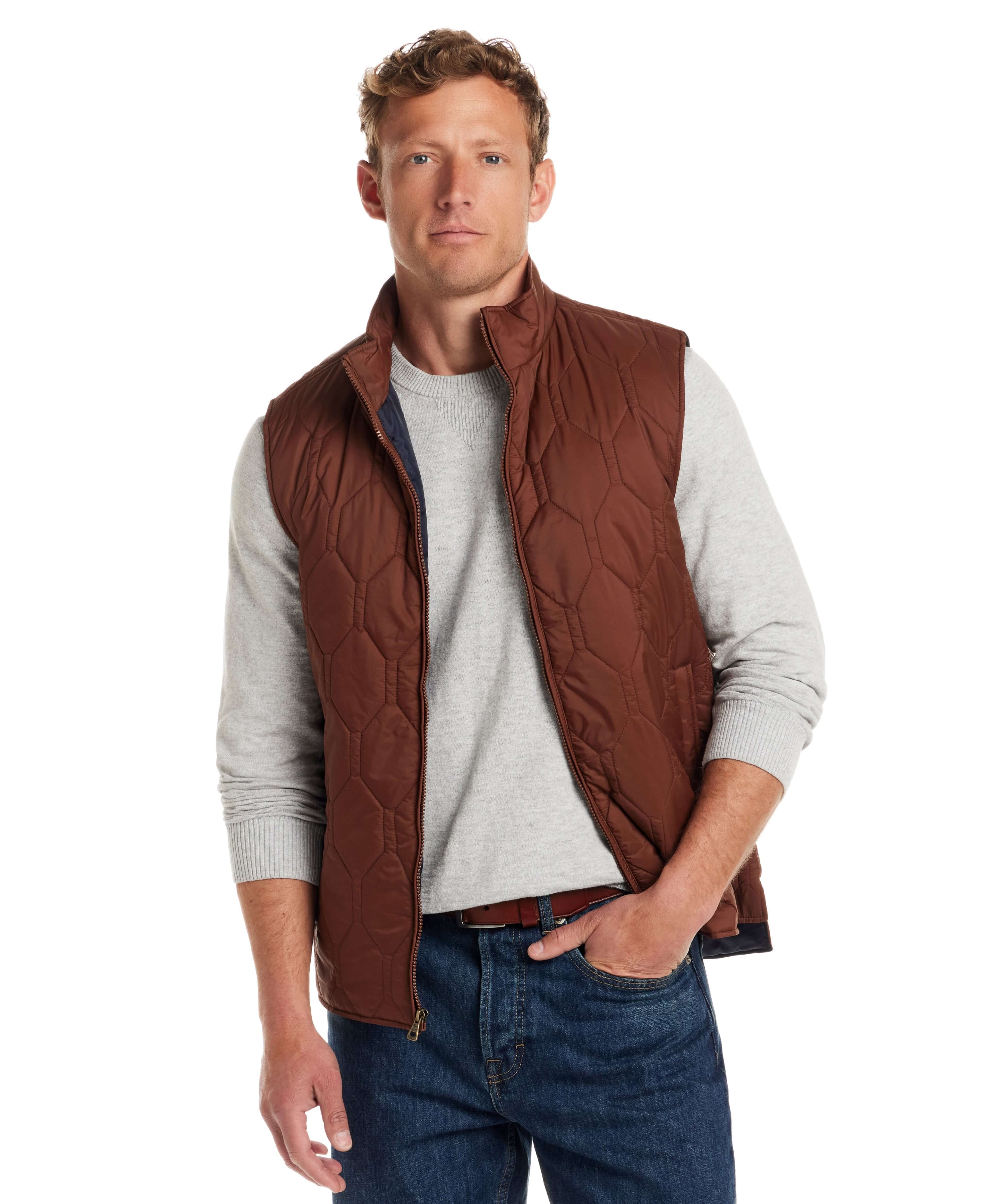 Model wearing a cappuccino Hexagon quilted lightweight vest made of nylon, featuring front zipper and two side pockets.