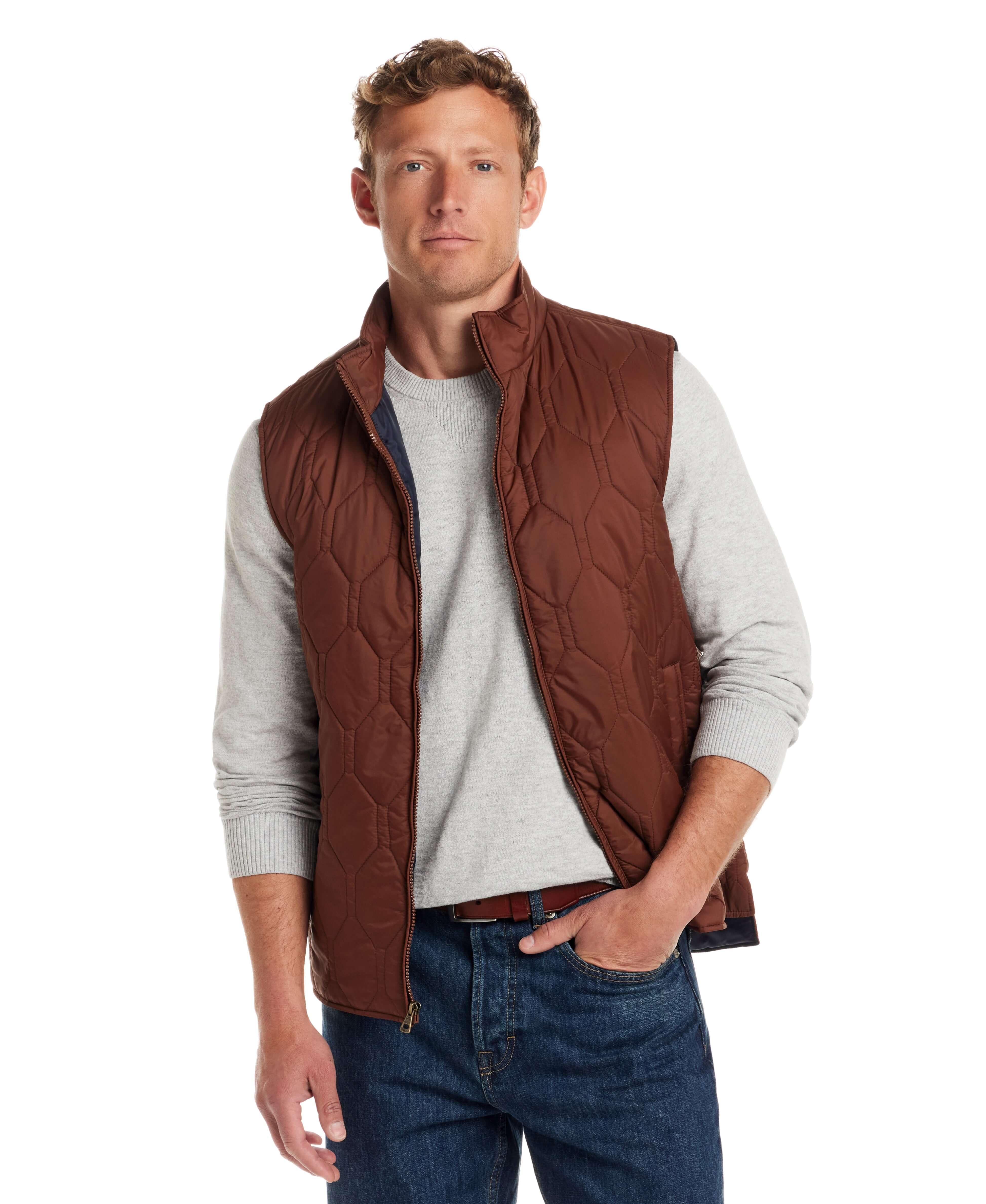 Model wearing a cappuccino Hexagon quilted lightweight vest made of nylon, featuring front zipper and two side pockets.