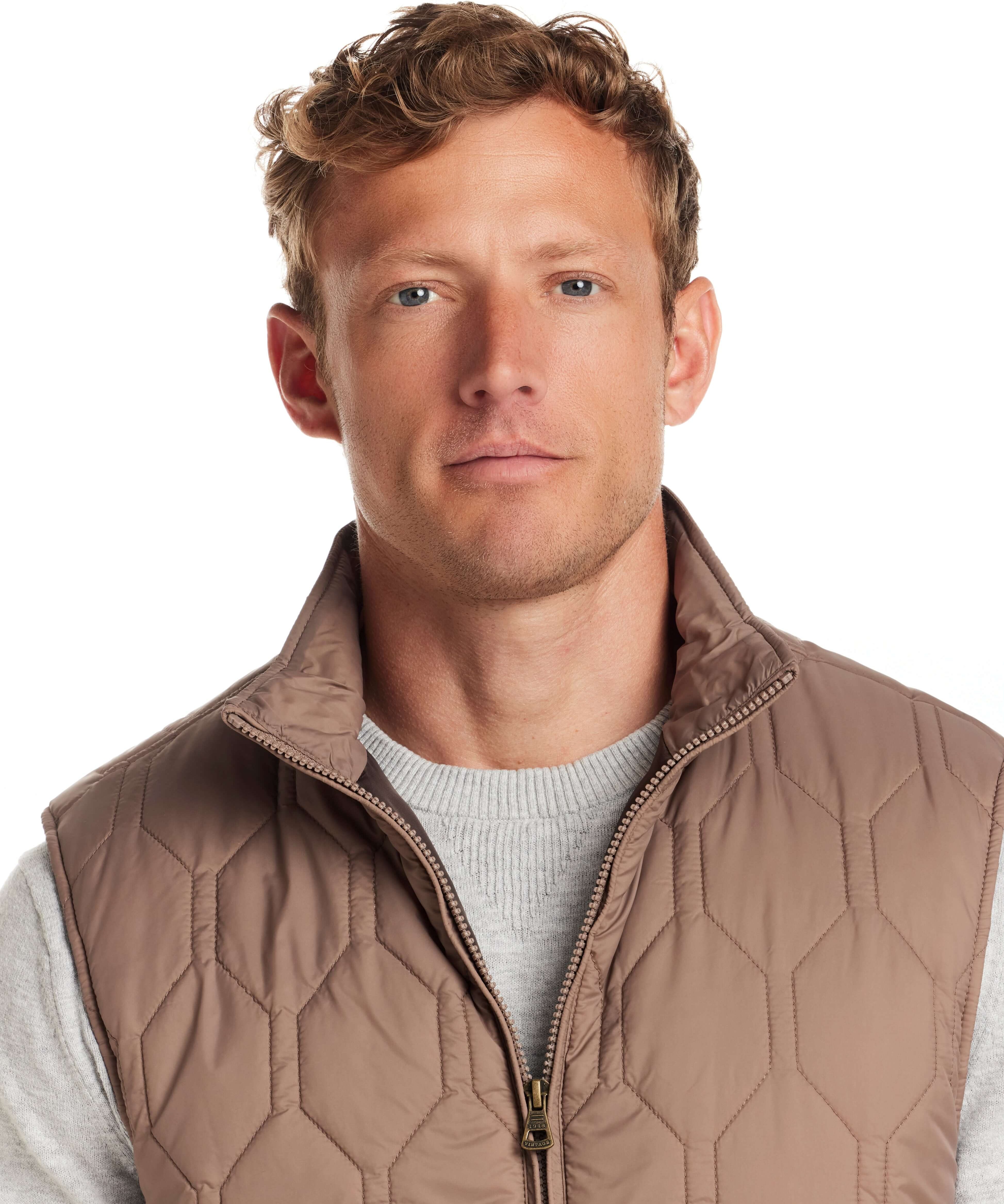 Man wearing a Hexagon Quilted Lightweight Vest in Mountain Trail, showcasing a stylish, rugged look.