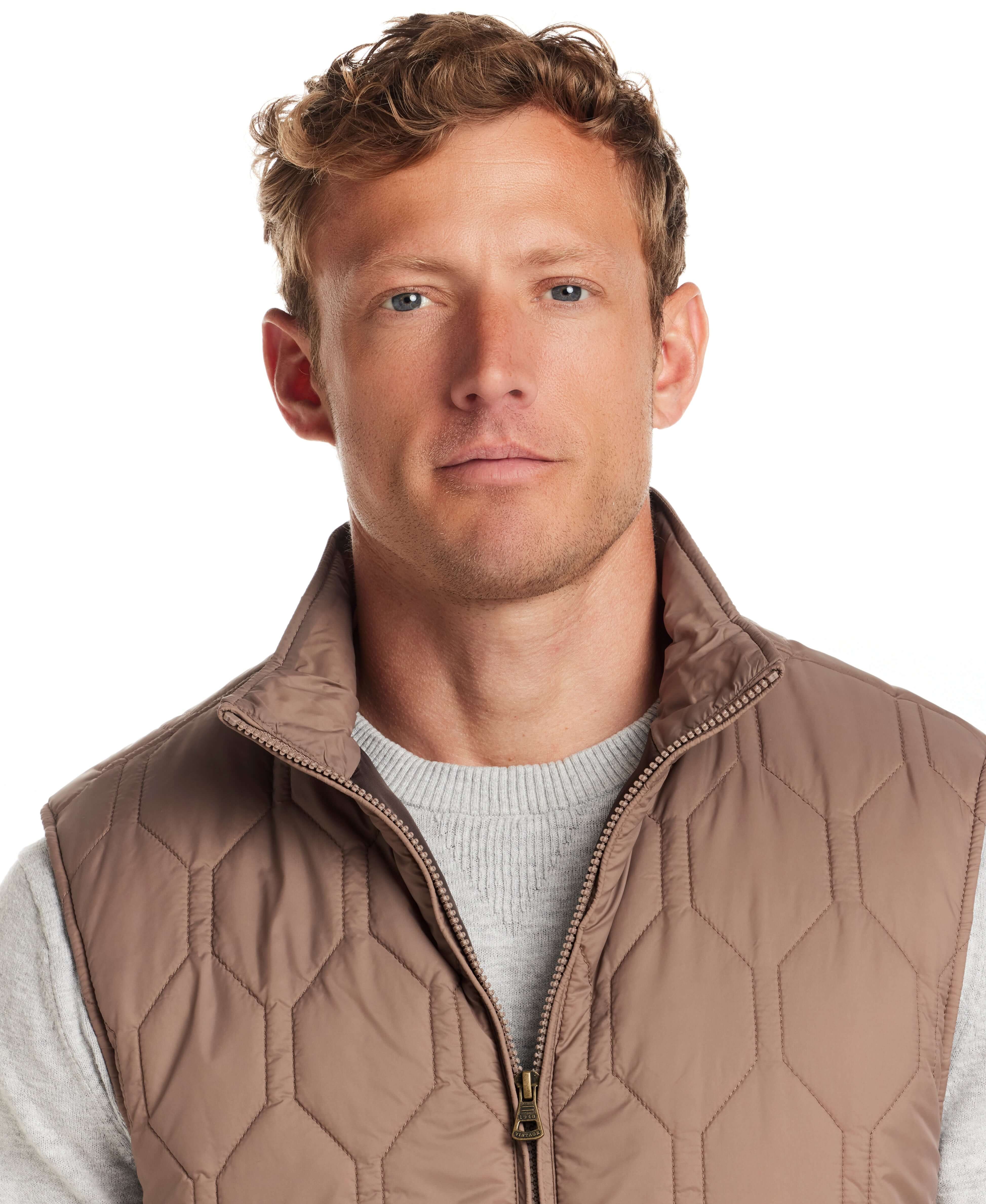 Man wearing a Hexagon Quilted Lightweight Vest in Mountain Trail, showcasing a stylish, rugged look.