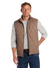 Hexagon quilted lightweight vest in mountain trail, featuring a front zipper and mock-neck style, perfect for rugged outdoor charm.