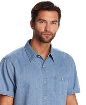 Model showcasing a short sleeve stripe denim shirt in serenity blue, featuring a classic collar and chest pocket.