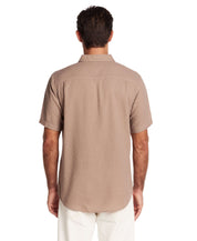 Back view of a short sleeve textured dobby button-down shirt in Mountain Trail color, showcasing a relaxed fit and clean lines.