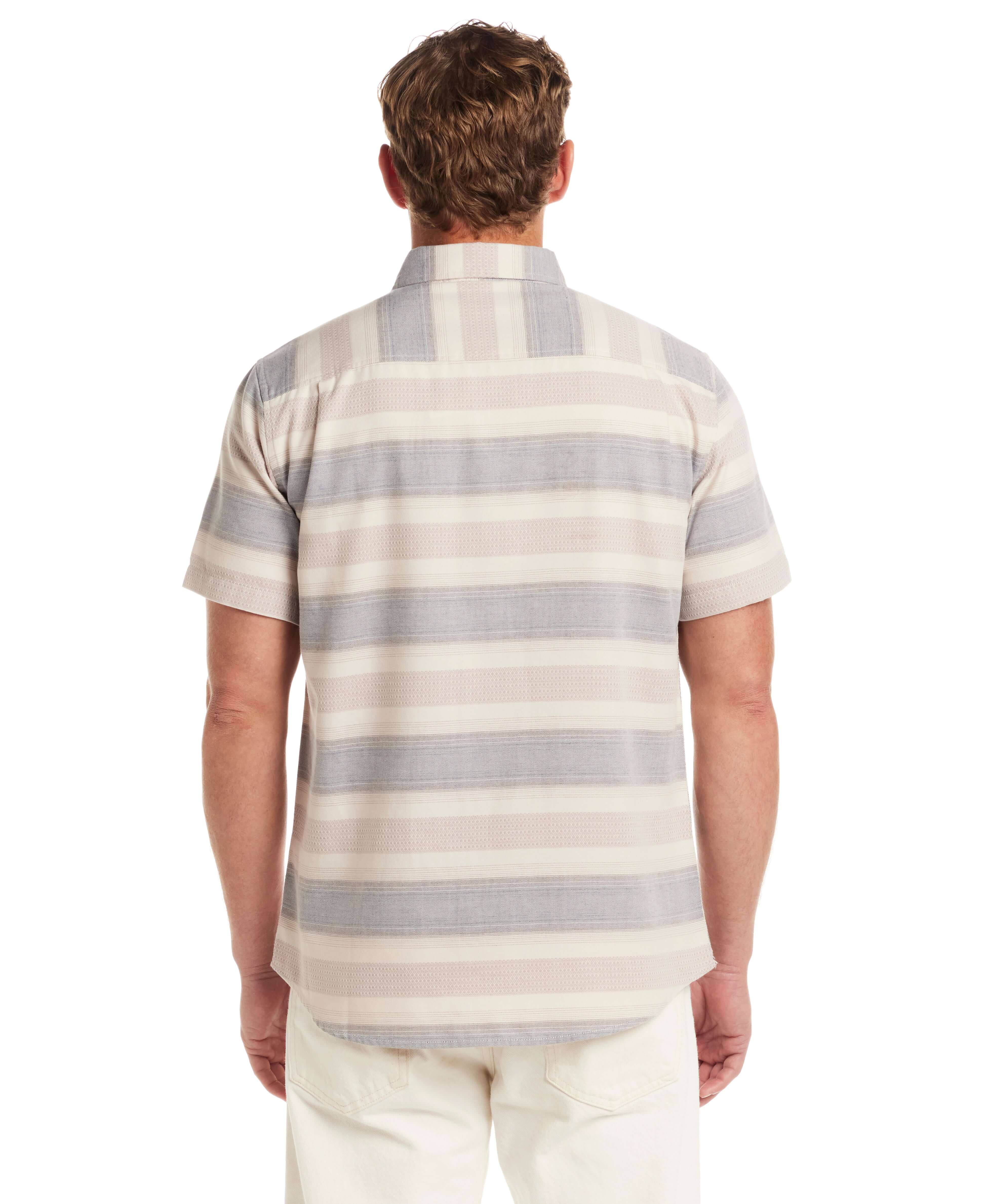Back view of a short sleeve shirt featuring a striped design in soft colors, showcasing its relaxed fit and lightweight fabric.