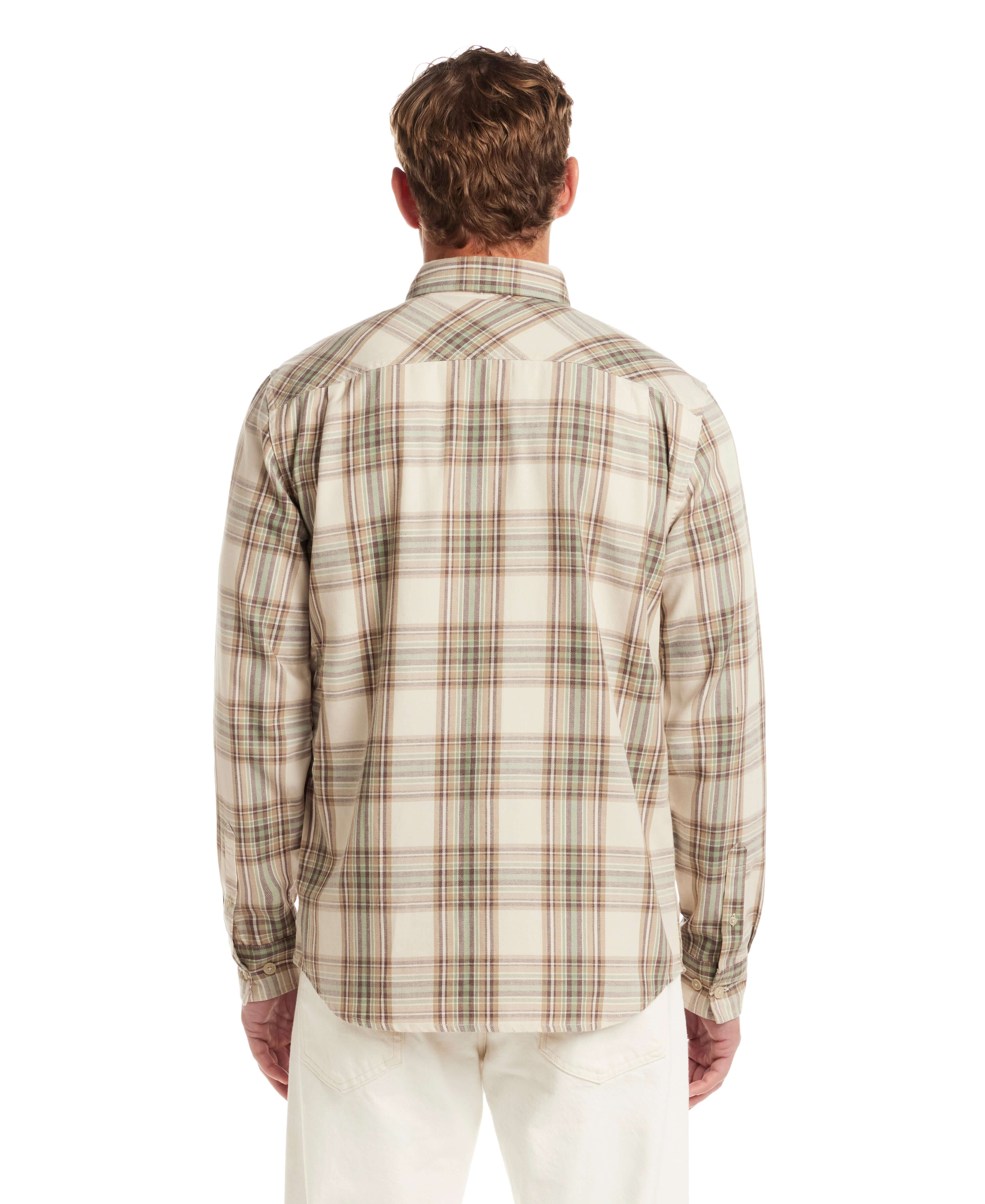 Back view of a man wearing a long sleeve burnout flannel shirt in angora, featuring a plaid pattern.