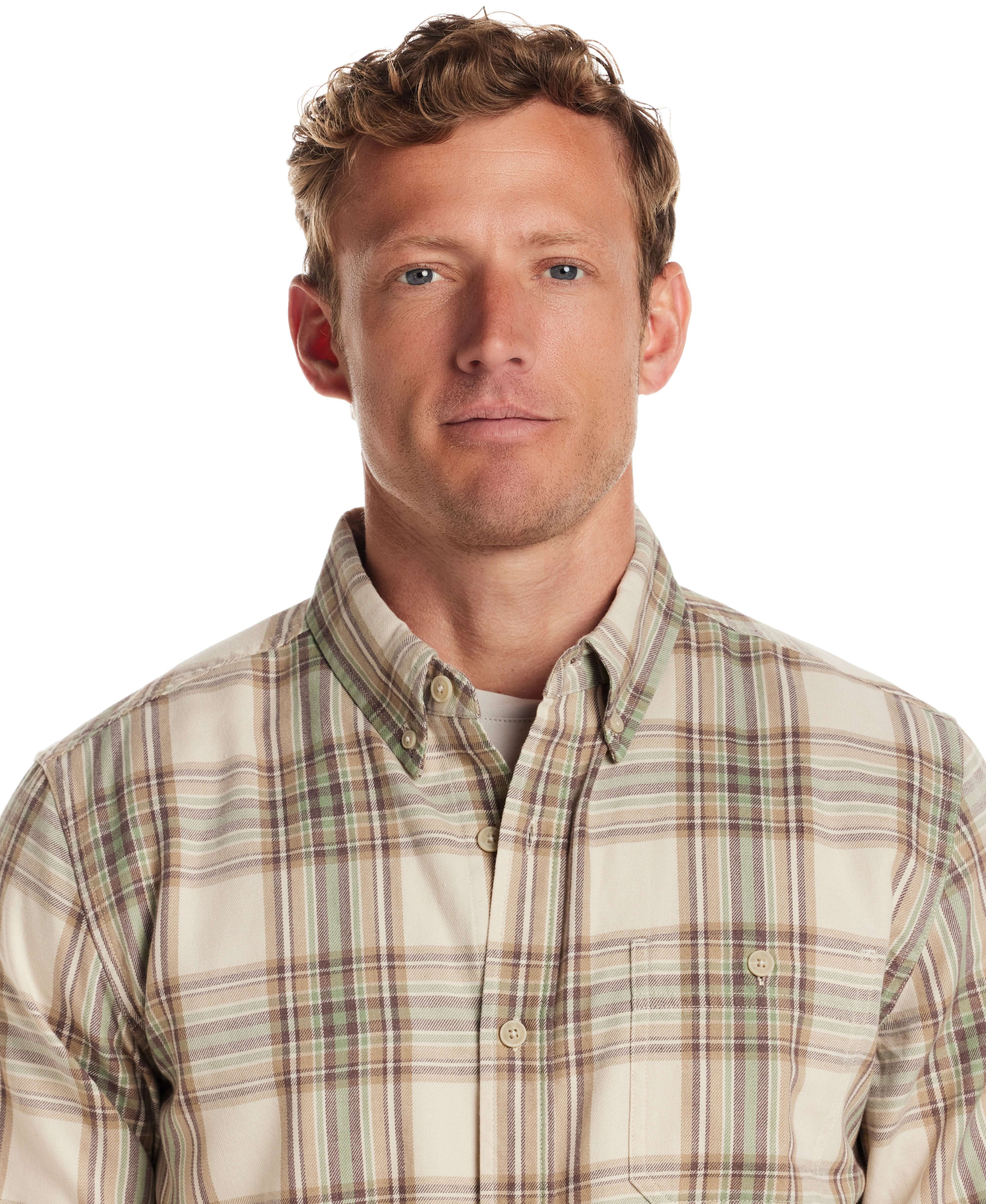 Model wearing a classic fit long sleeve burnout flannel shirt in soft lightweight material with plaid design.