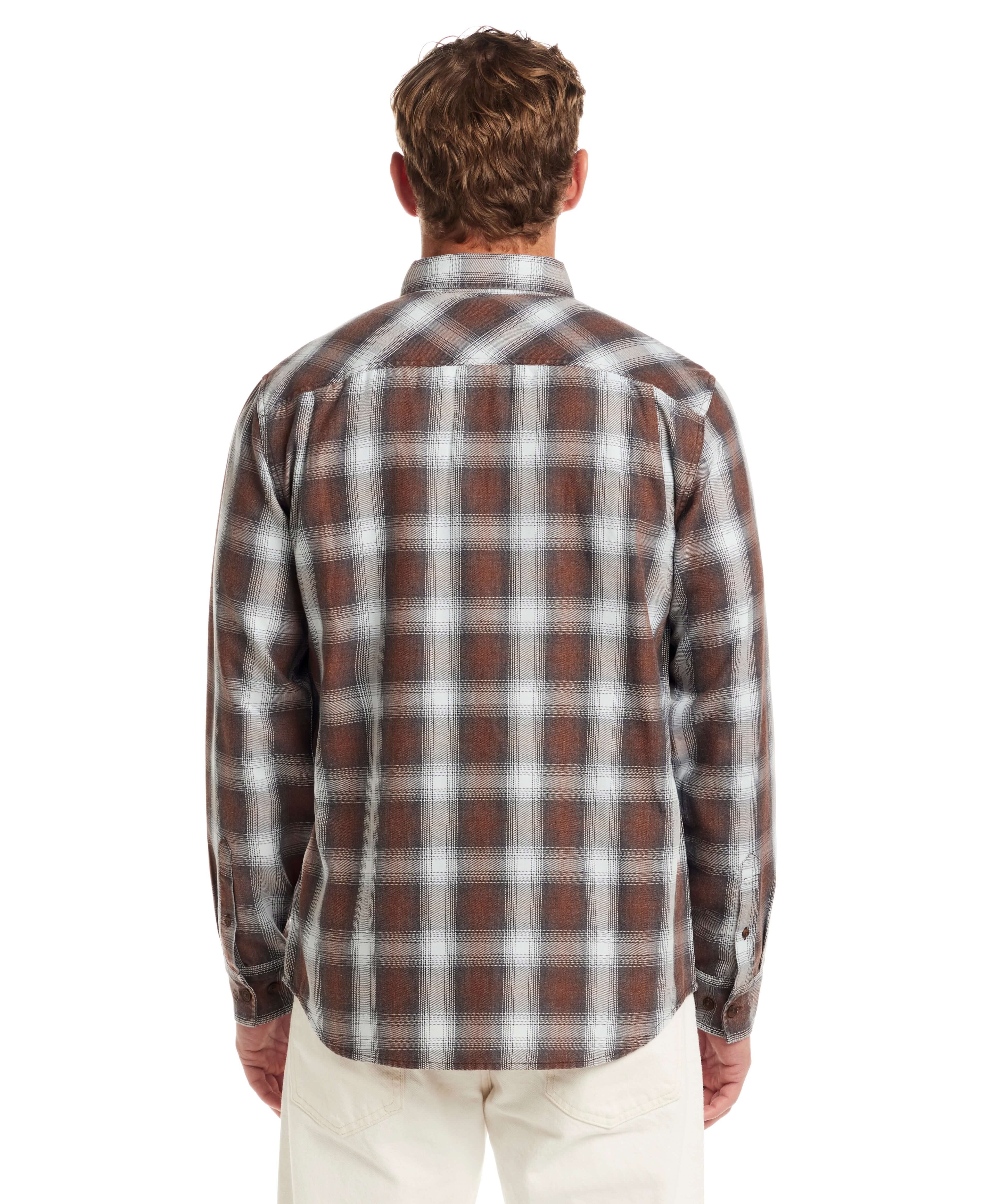 Back view of a Long Sleeve Burnout Flannel in Chicory, featuring a classic plaid pattern and buttoned cuffs.