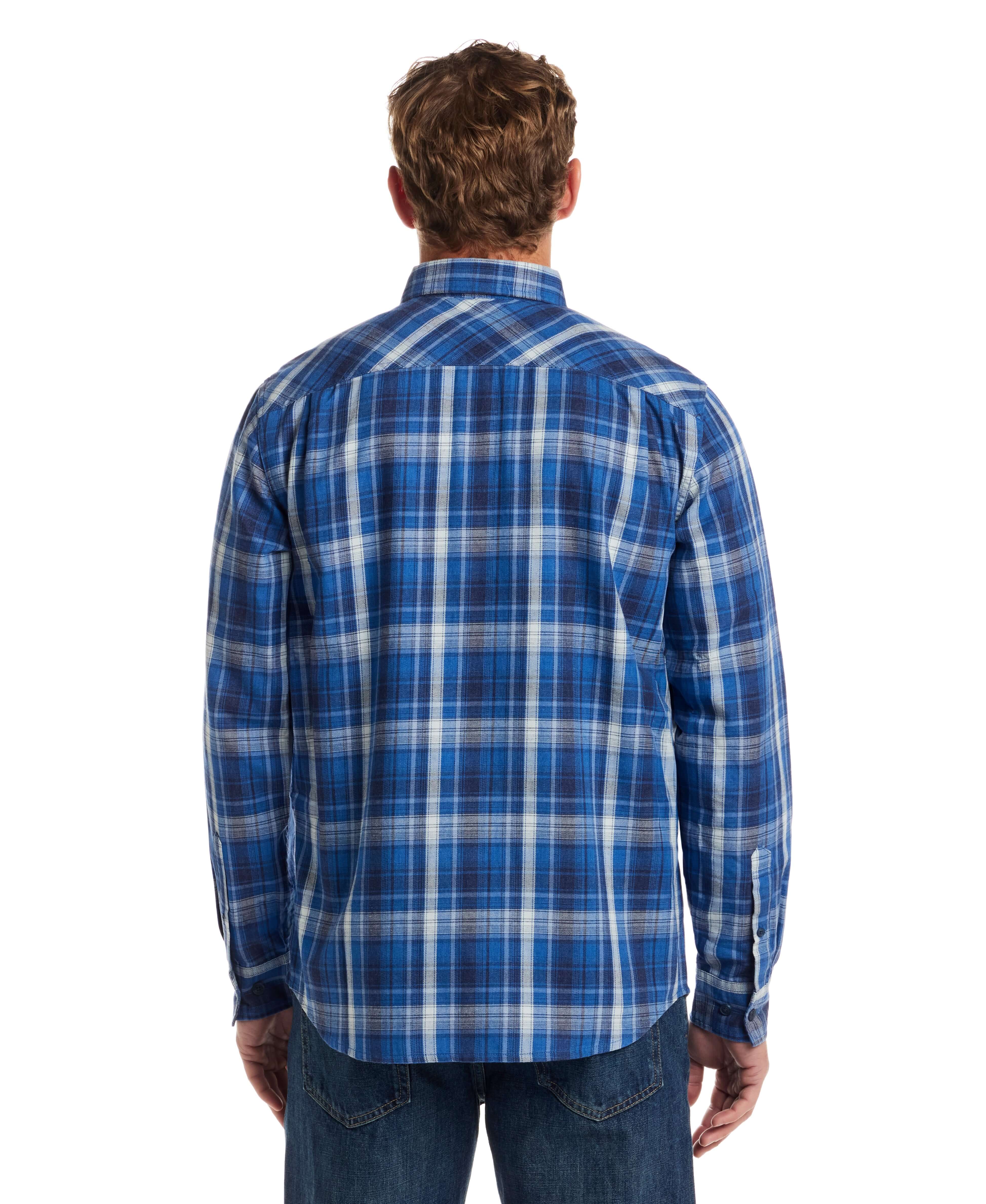 Back view of a man wearing a long sleeve burnout flannel shirt in strong blue, featuring a classic plaid pattern.