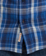Close-up of Long Sleeve Burnout Flannel shirt in Strong Blue, featuring a classic plaid pattern and button details.