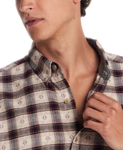Close-up of a man wearing a long sleeve brushed flannel shirt in Merlot, showcasing a classic button-down design and plaid pattern.