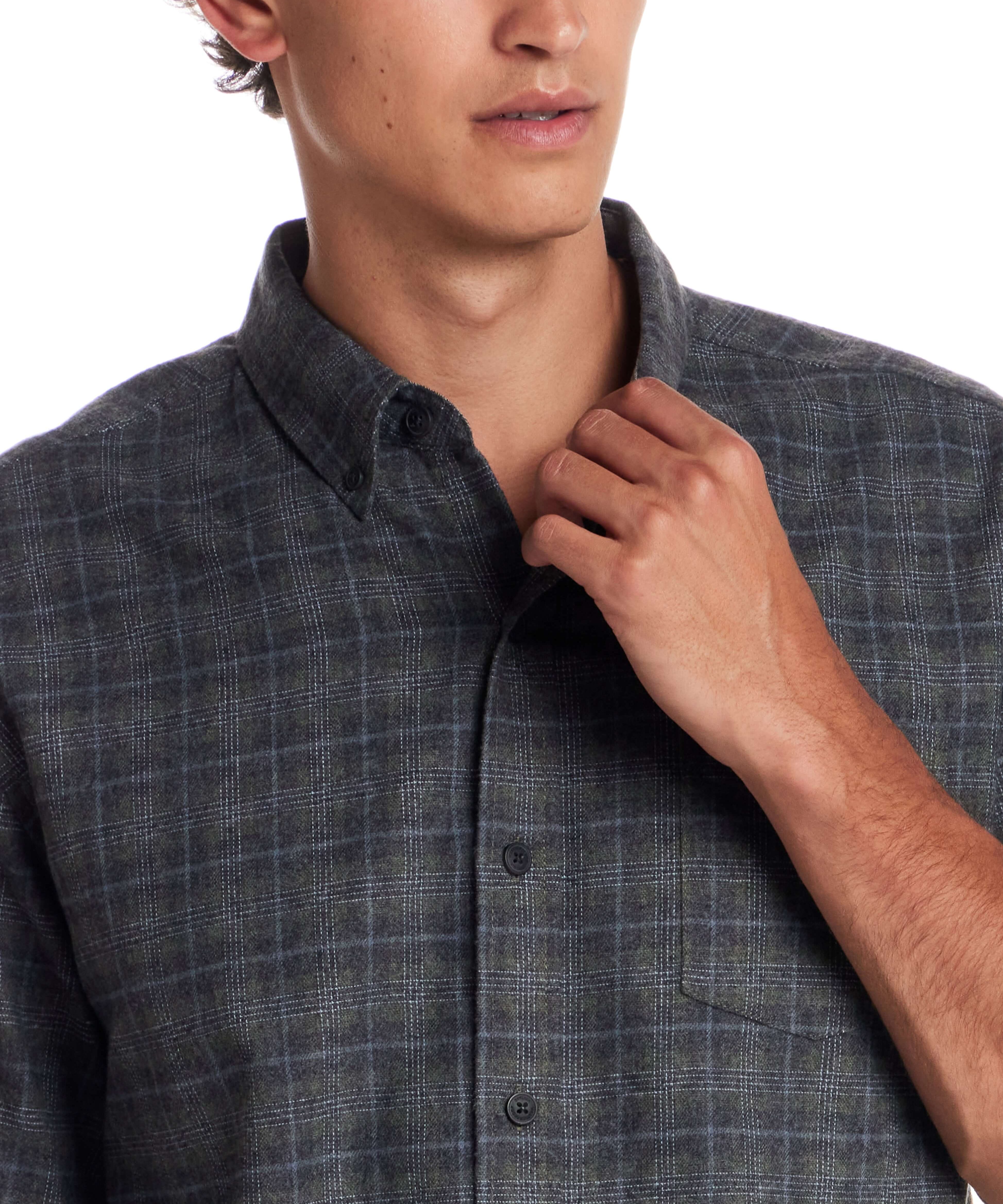 Man wearing a Long Sleeve Brushed Flannel shirt in Winter Moss, highlighting its classic button-down style.