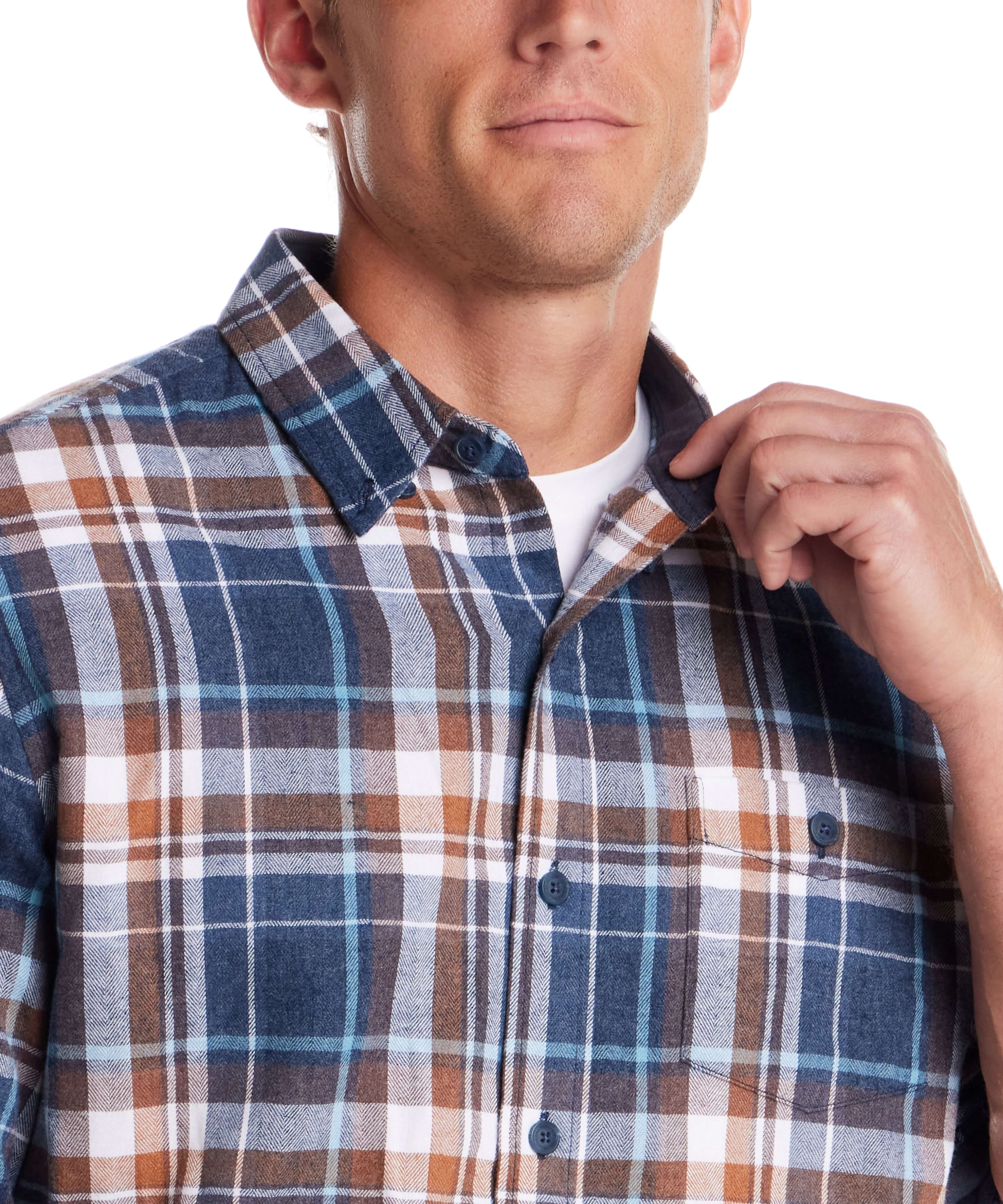 Close-up of a man wearing a long sleeve brushed flannel shirt in Oceana, featuring classic plaid patterns.
