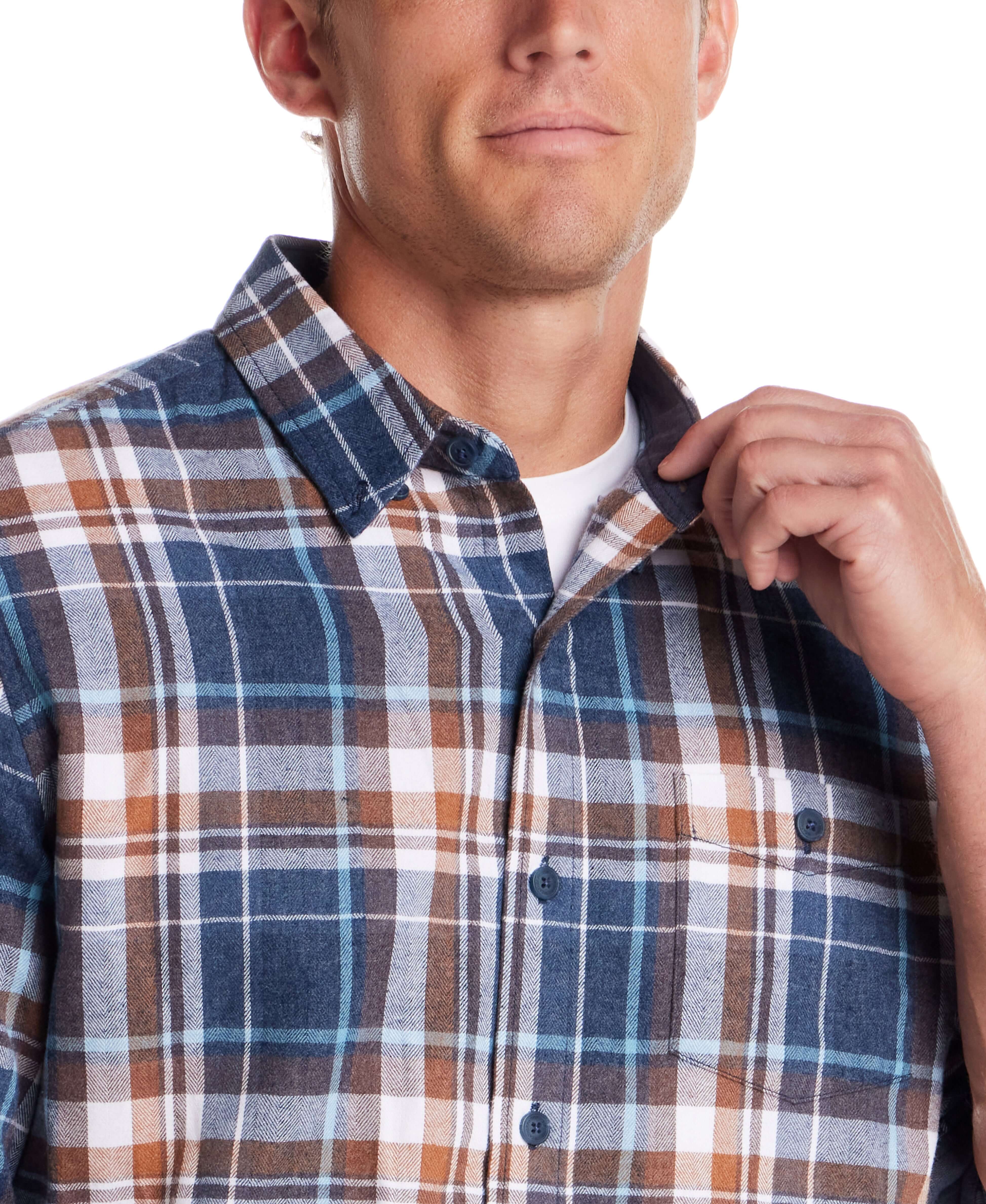 Close-up of a man wearing a long sleeve brushed flannel shirt in Oceana, featuring classic plaid patterns.