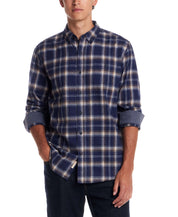 Man wearing a long sleeve brushed flannel shirt in Ocean Cavern, featuring a classic plaid pattern and button-down collar.