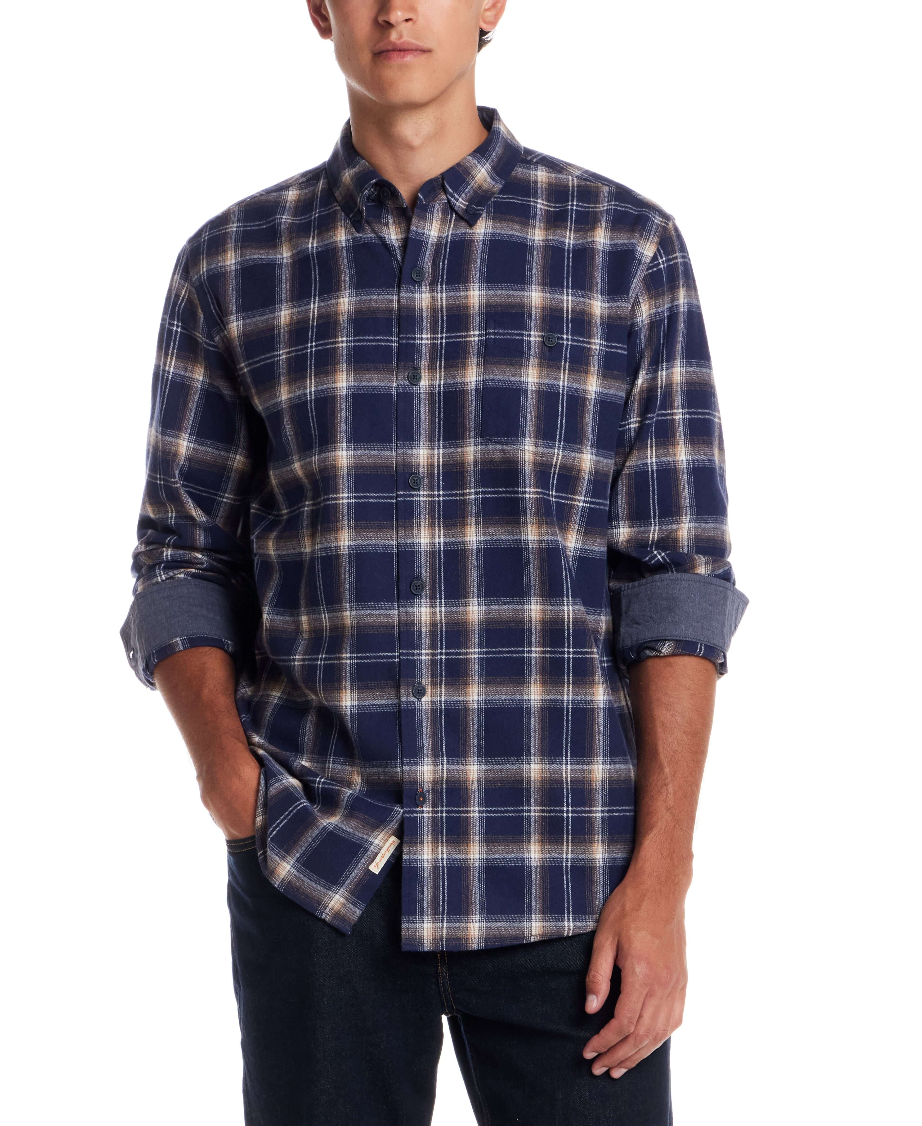 Man wearing a long sleeve brushed flannel shirt in Ocean Cavern, featuring a classic plaid pattern and button-down collar.