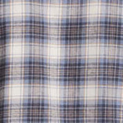 Close-up of Windward Blue brushed flannel fabric features a classic plaid pattern in shades of blue and white.