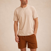 Striped Stretch Crewneck T-Shirt in Tan worn by a man with short sleeves and clean stripe pattern.