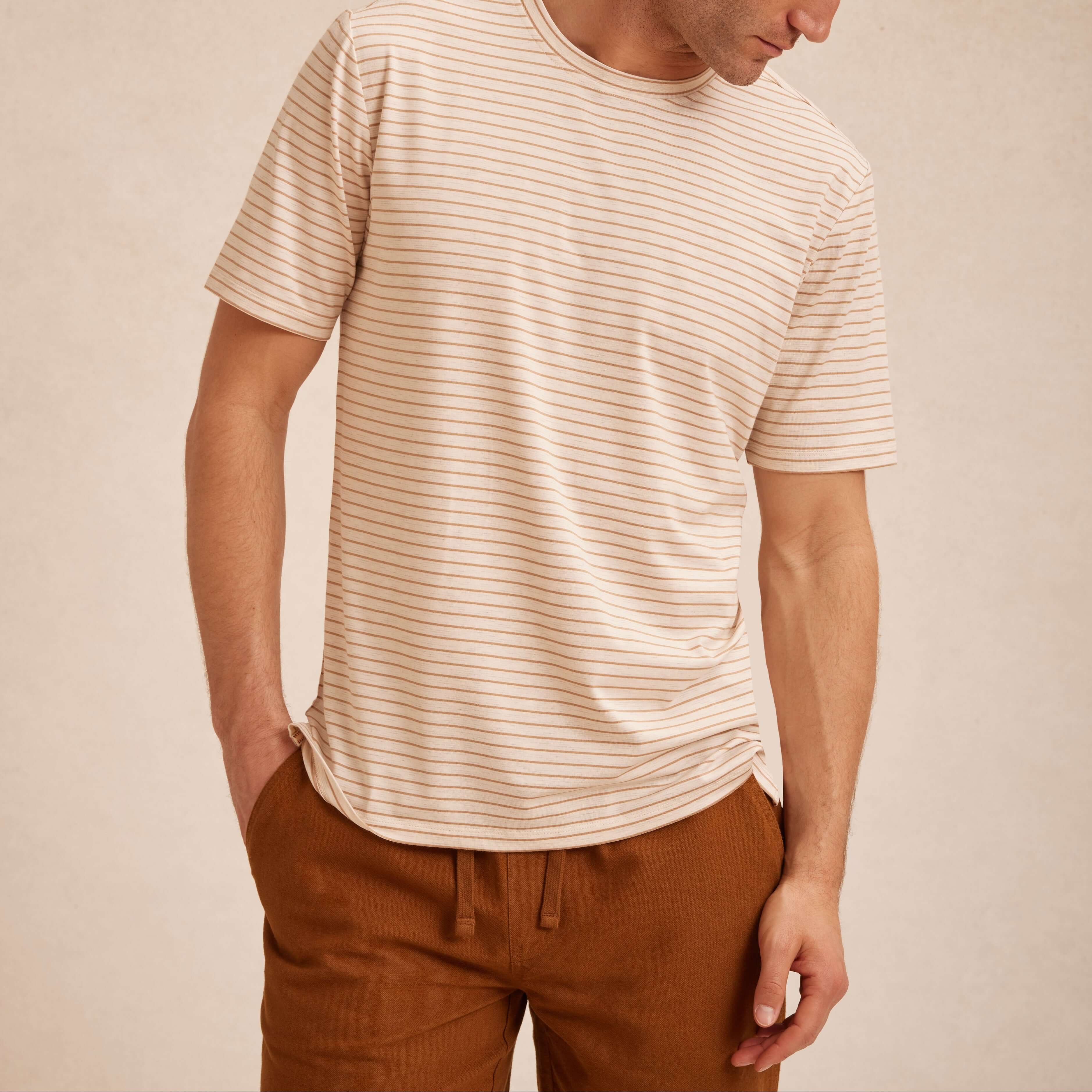 Striped Stretch Crewneck T-Shirt in Tan worn by a model, showcasing its soft fabric and stylish stripe design.