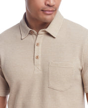 Waffle Polo In Antique White features a classic fit, waffle texture, short sleeves, and vintage button details.