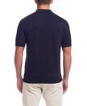 Short Sleeve Polo Sweater In Navy shown from the back, featuring a standard fit and comfortable design.