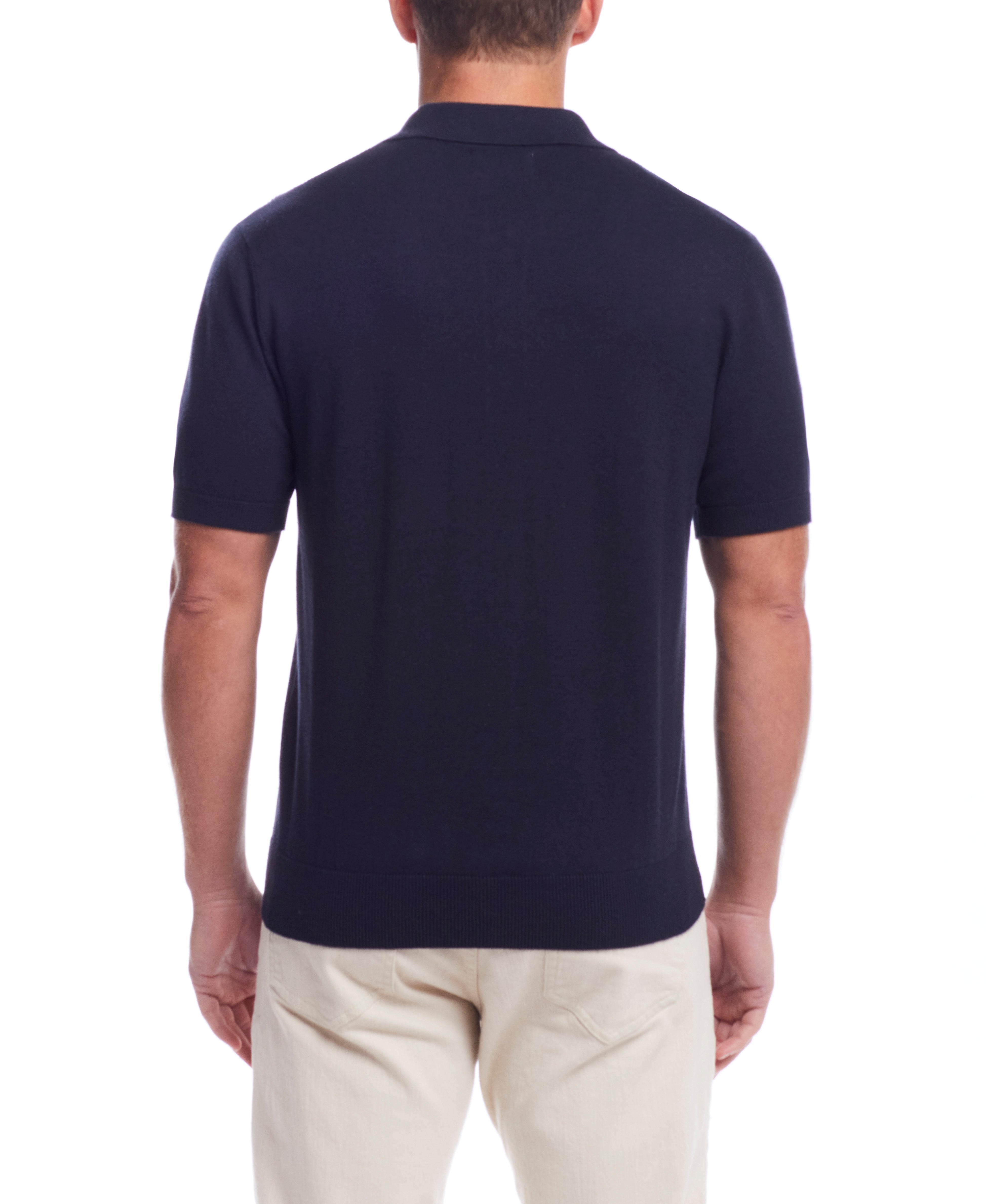 Short Sleeve Polo Sweater In Navy shown from the back, featuring a standard fit and comfortable design.