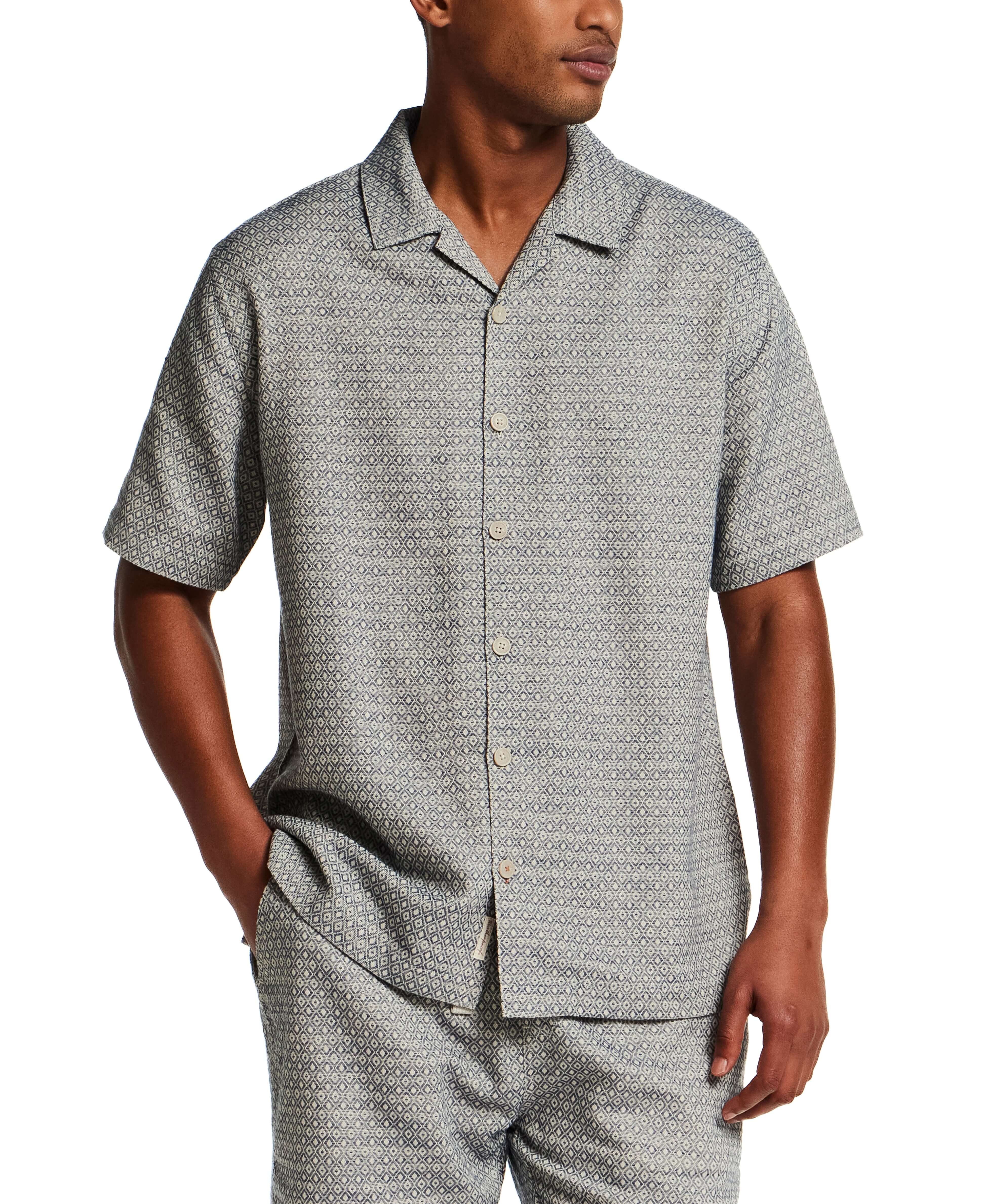 Model wearing Jacquard Resort Shirt in Navy Diamond, featuring textured fabric and relaxed fit for vacation styling.