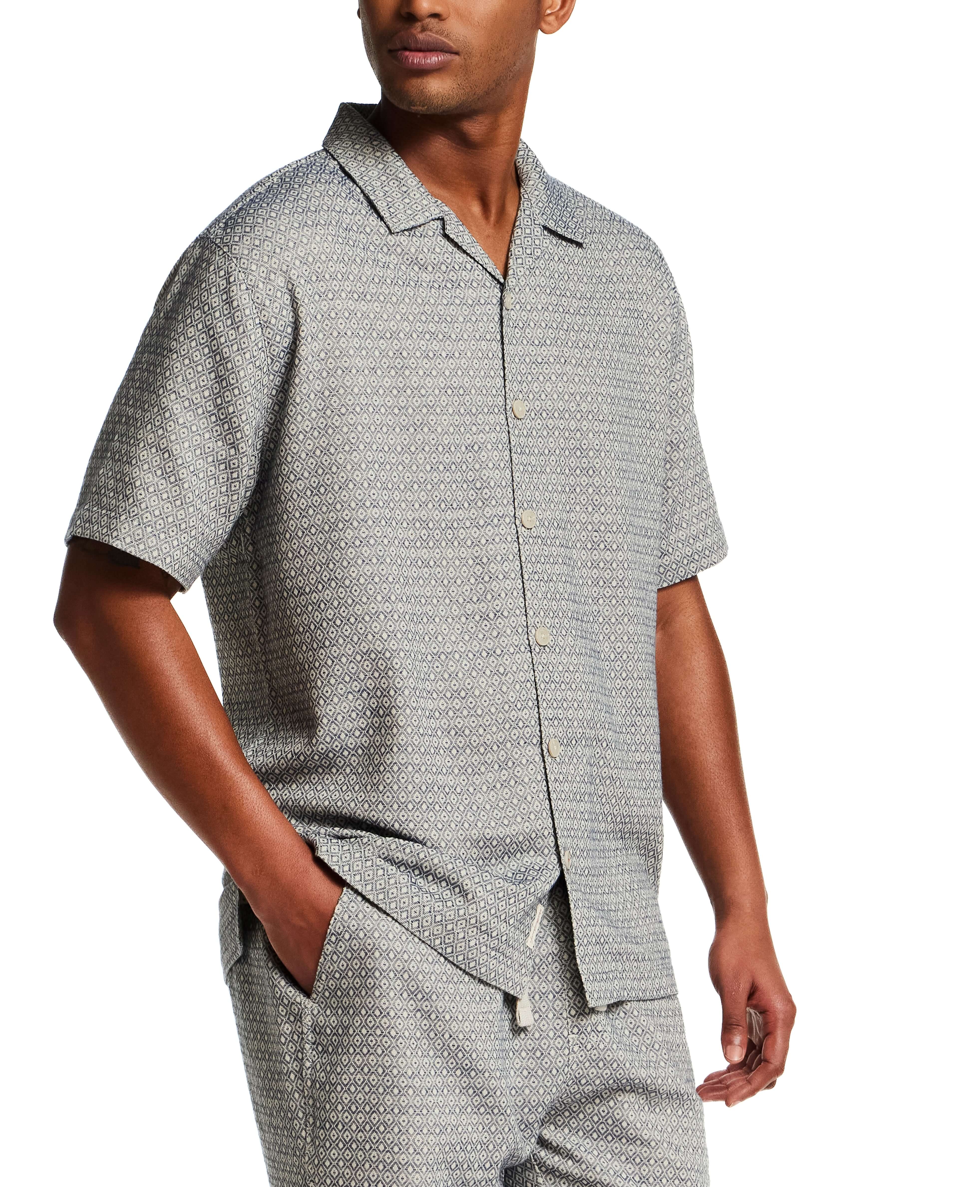 Model wearing a Jacquard Resort Shirt in Navy Diamond with a relaxed fit and textured fabric.