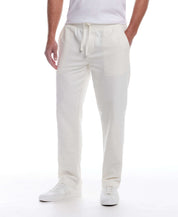 Linen Blend Drawstring Pants in White modeled by a man wearing a white shirt and sneakers.