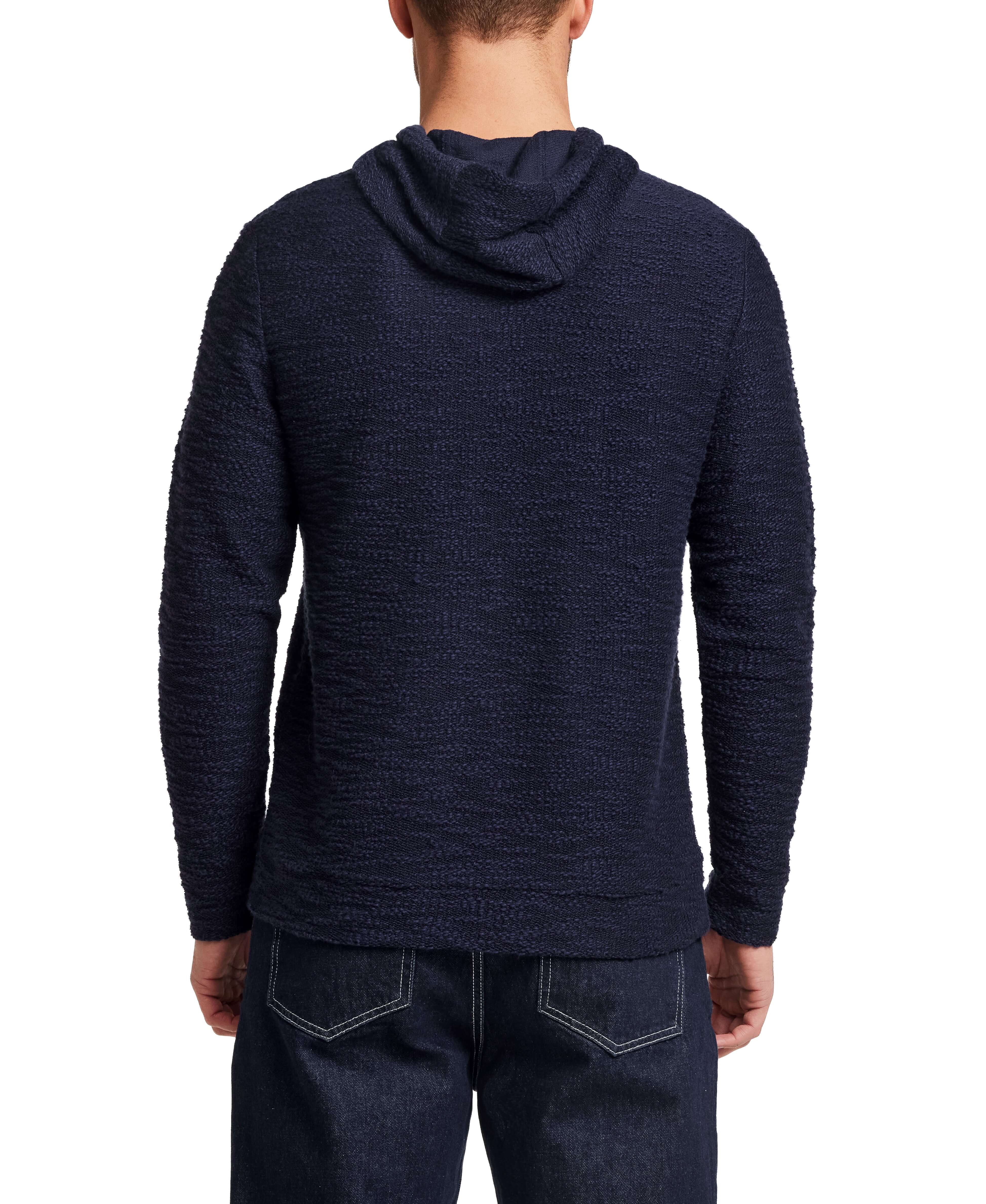Back view of a man wearing a Slub Knit Pullover Hoodie in Maritime Blue, showcasing its textured slub knit fabric.