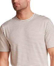 Striped Stretch Crewneck T-Shirt in Stone Grey featuring a lightweight design and striped pattern, modeled by a man.