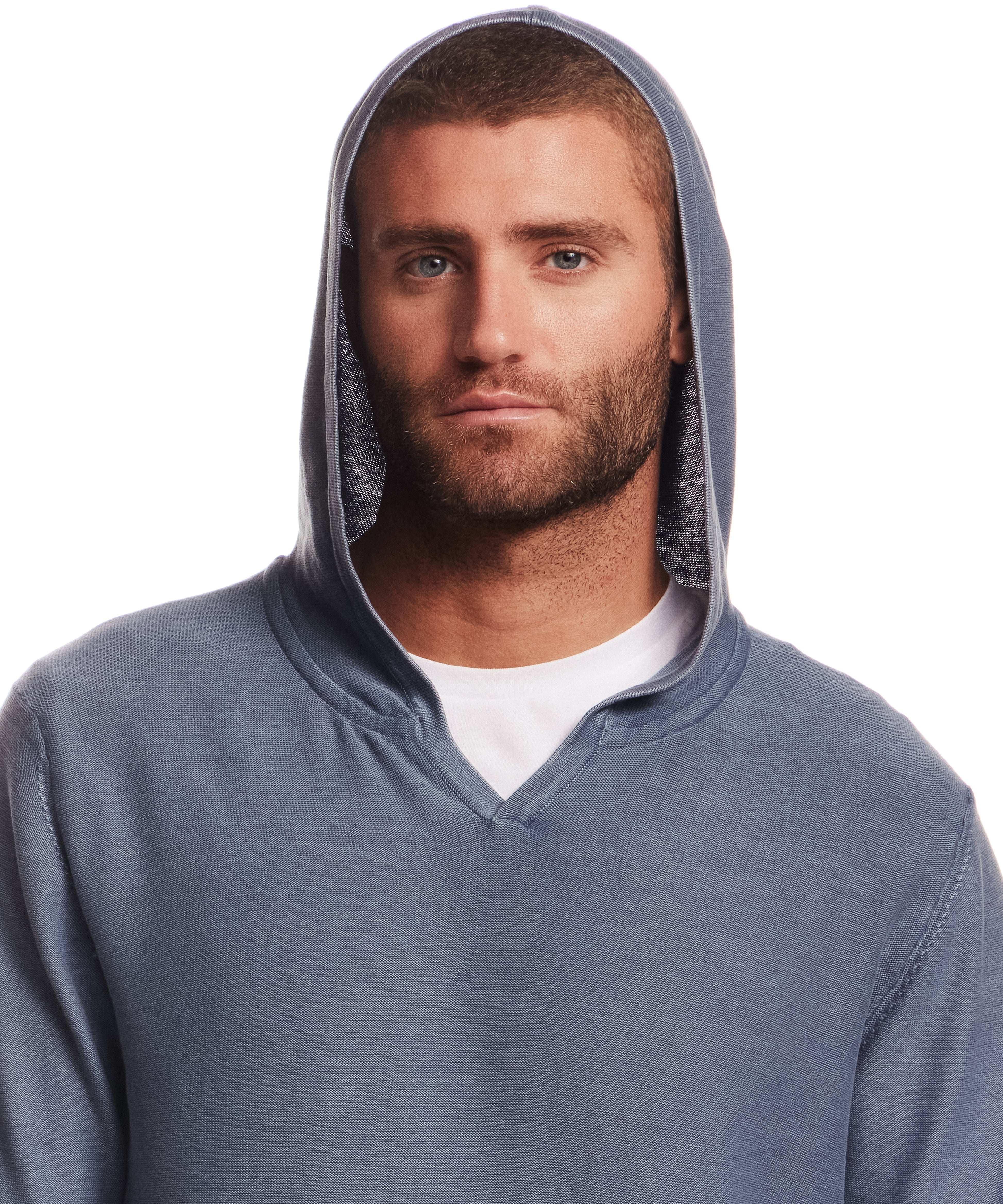 STONE WASH HOODED SWEATER W POCKET in ENSIGN BLUE worn by a model with a serious expression.
