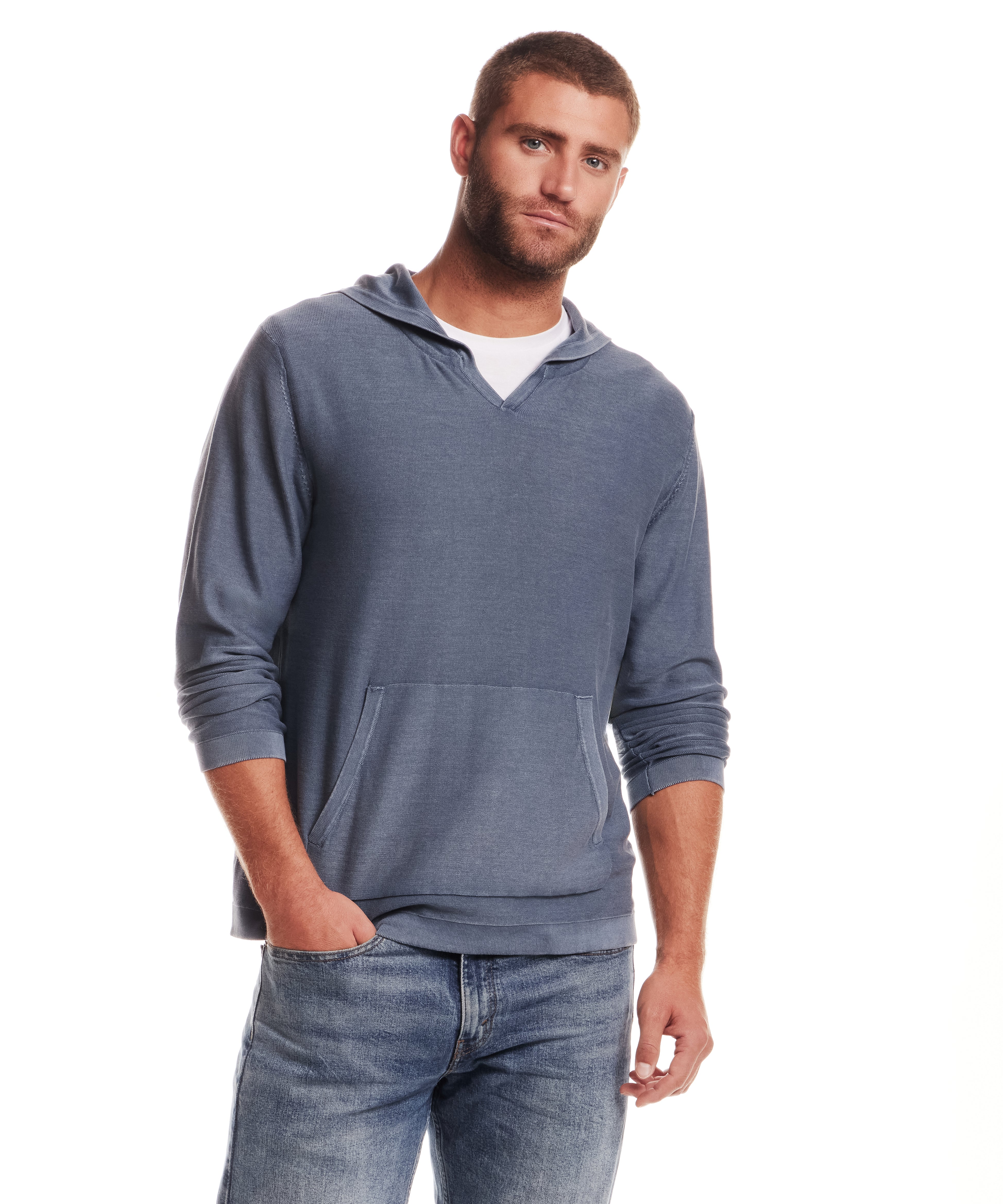 STONE WASH HOODED SWEATER W POCKET in ENSIGN BLUE worn by a male model, featuring a cozy hood and front pocket.