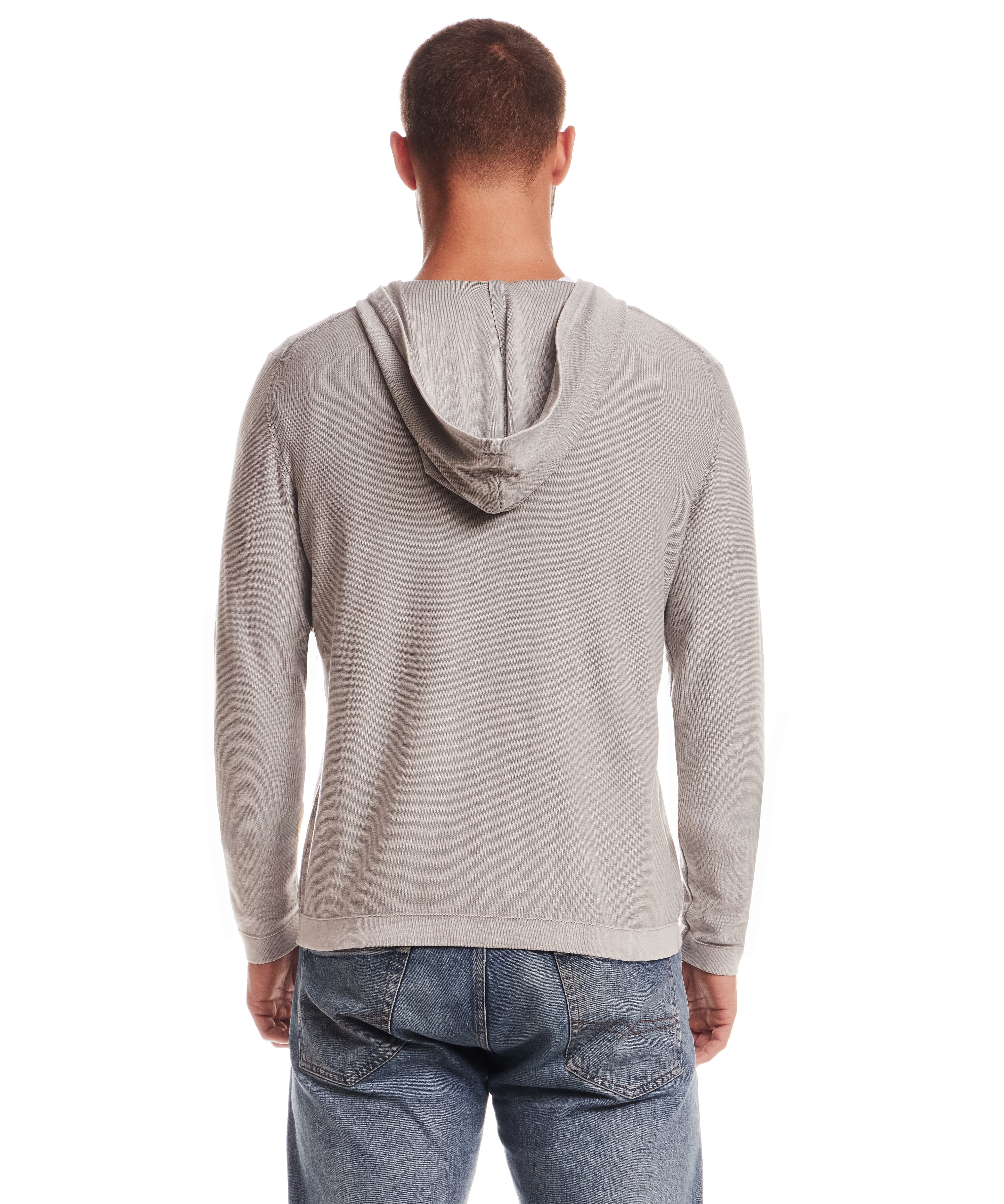 Back view of a man wearing a Stonewash Hooded Sweater in Ultimate Grey with casual jeans.