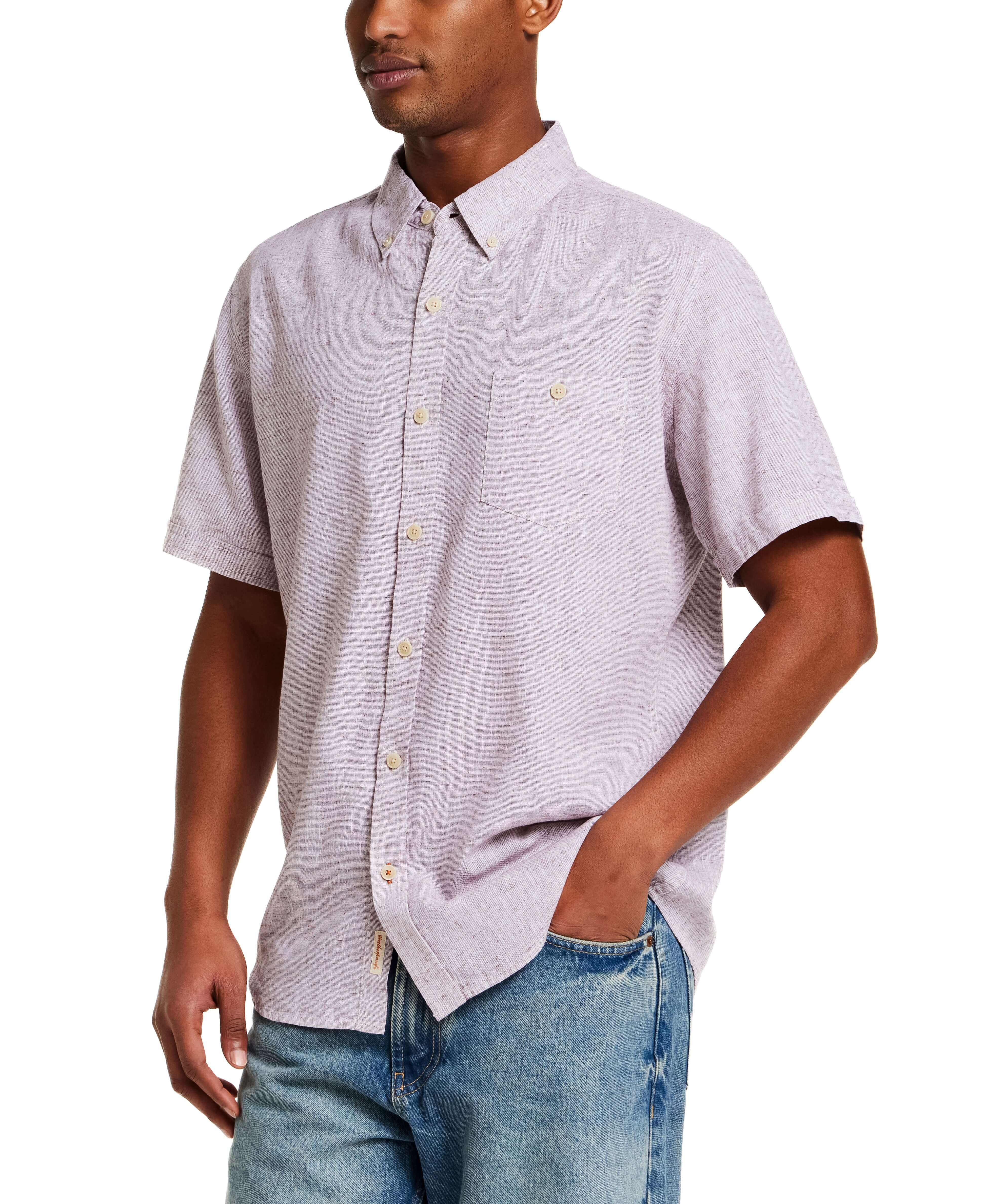 Short Sleeve Solid Linen Cotton in Rose Brown model wearing a casual shirt paired with denim jeans.