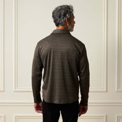 Back view of a man wearing a Bold Plaid Jacquard Button Down Shirt in Black Khaki.