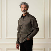 Bold Plaid Jacquard Button Down Shirt in Black Khaki worn by a model, showcasing its stylish design and comfortable fit.