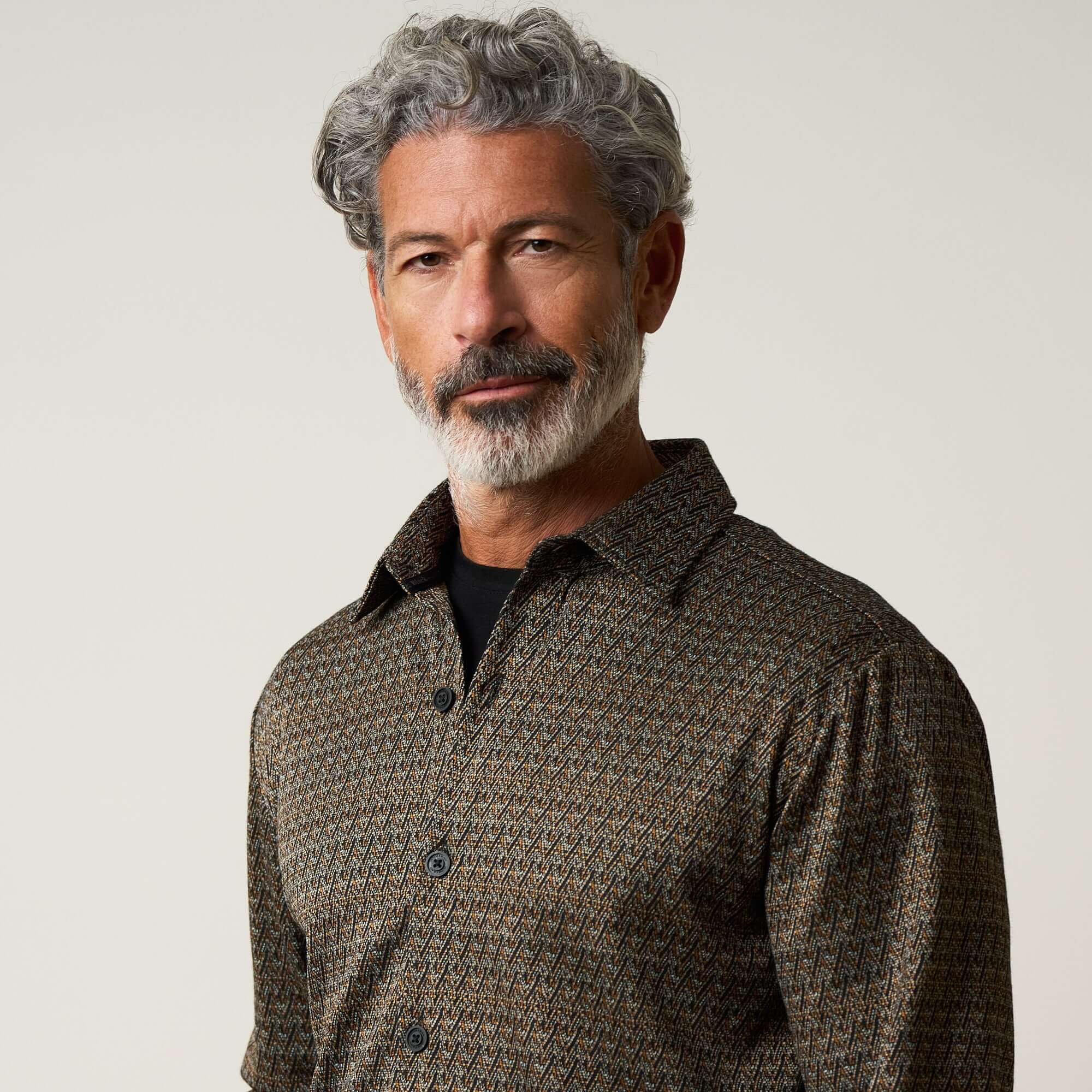 Bold Plaid Jacquard Button Down Shirt in Black Khaki worn by a man with gray hair and beard, showcasing the stylish pattern.
