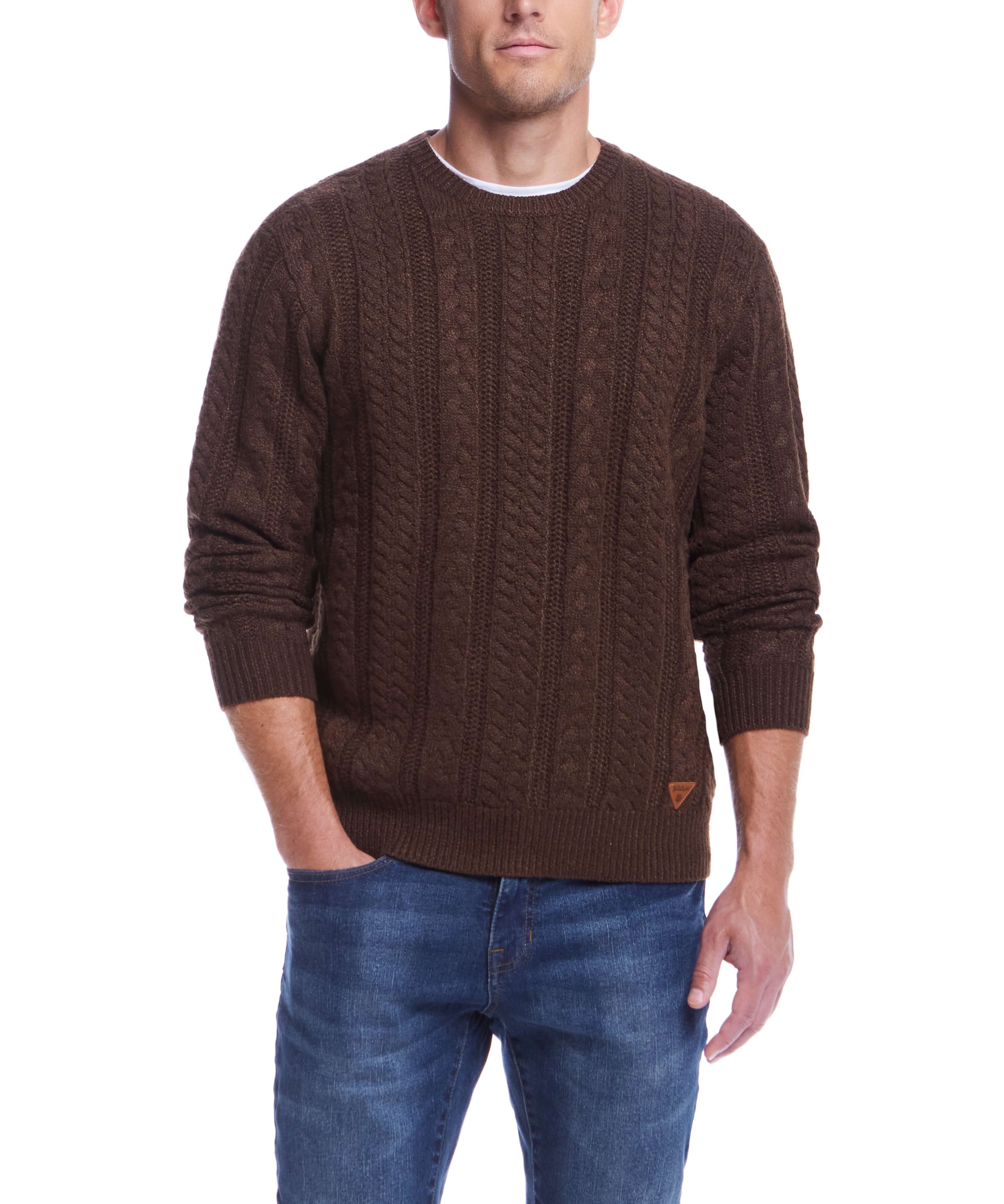 Man in a brown allover cable knit sweater with crew neck, paired with jeans, ideal for cooler weather.