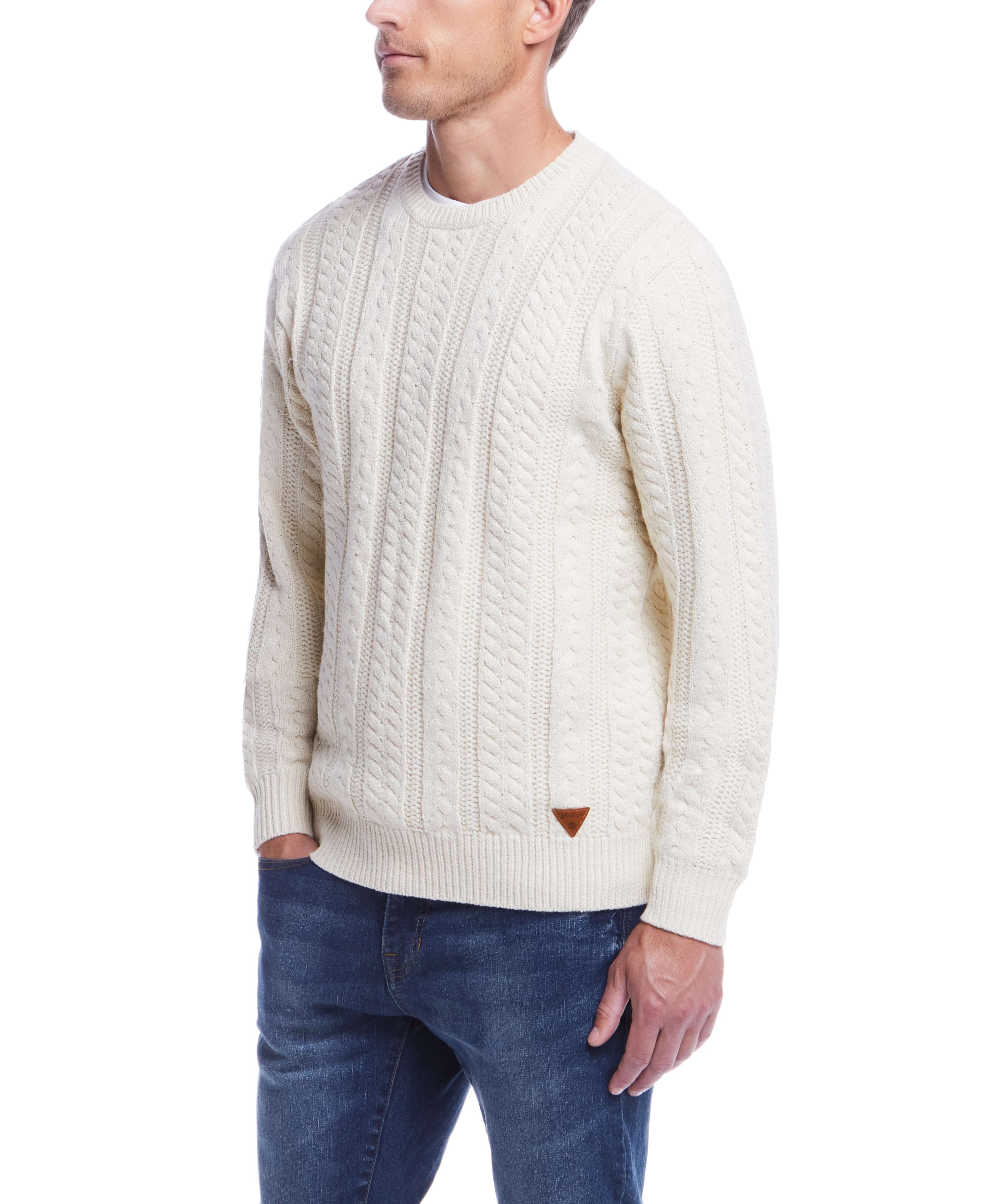 Model wearing Allover Cable Crew sweater in Whitecap, ideal mid-layer for cooler weather, featuring classic cable knit design.