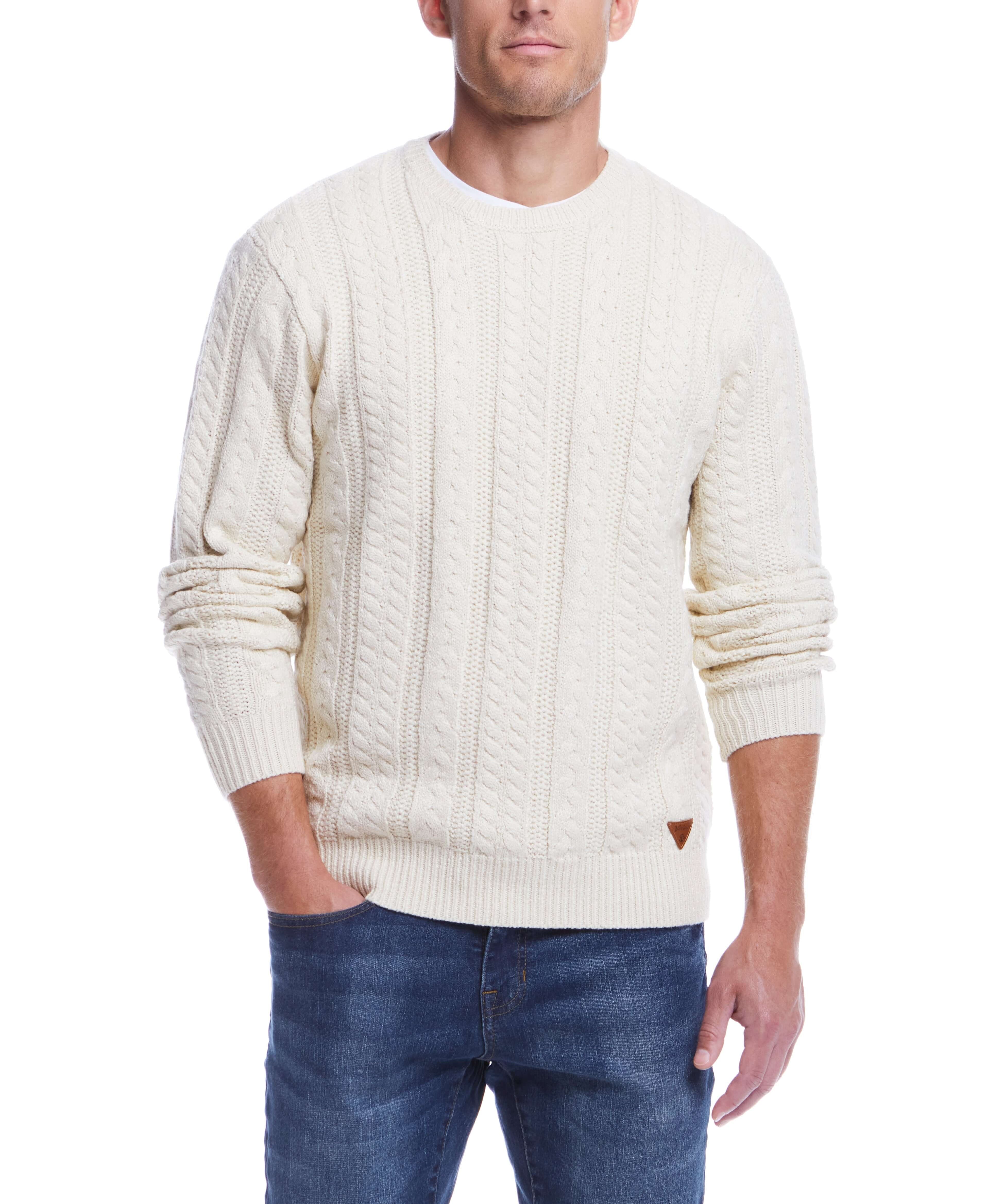 Model wearing an allover cable knit crew sweater in Whitecap, perfect for cooler weather.