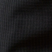 Check Pants in Black/Charcoal fabric close-up showcasing subtle checkered pattern texture.