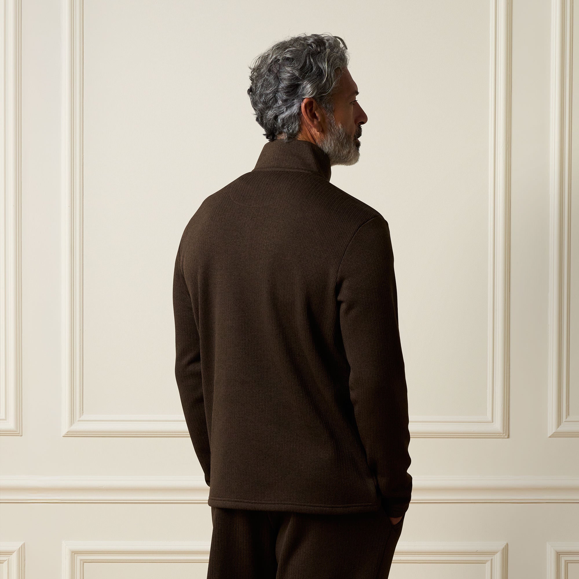 Ribbed Quarter Zip in Brown showcasing the back view, featuring a quarter-zip neckline and soft ribbed texture.