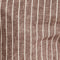 Chambray Stripe Drawstring Short in Brown Stripe fabric close-up featuring lightweight brown linen-cotton with vertical stripes.