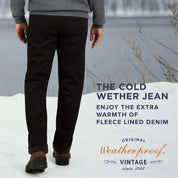 Man wearing fleece lined jeans by Weatherproof in a winter setting, showcasing warmth and comfort for cold weather.