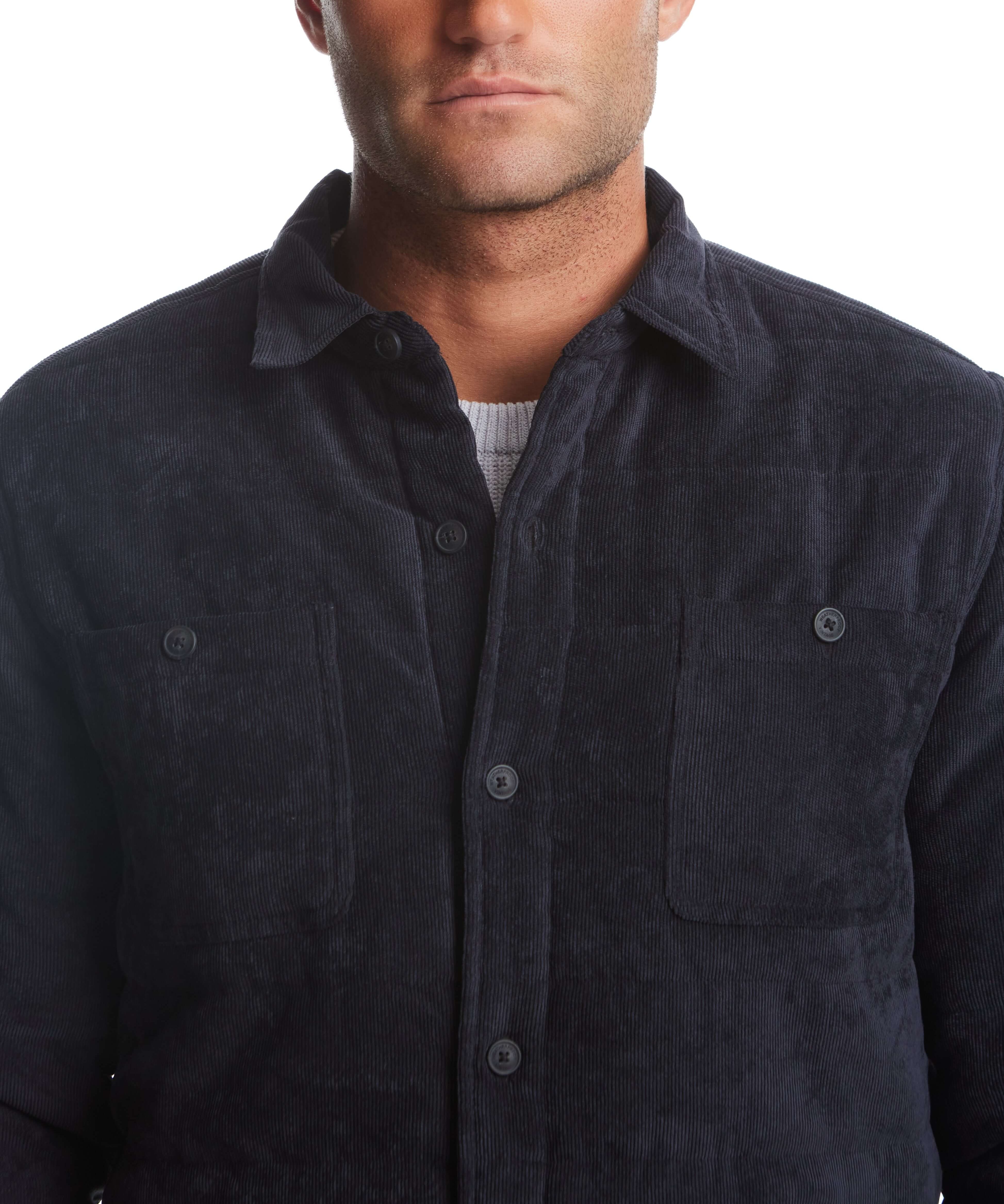 Men's corded puffer jacket in Moonless Night showcasing button front, chest pockets, and soft corduroy fabric.