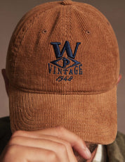 Corduroy Relaxed Hat in Brown featuring a vintage logo, perfect for staying warm and stylish this season.