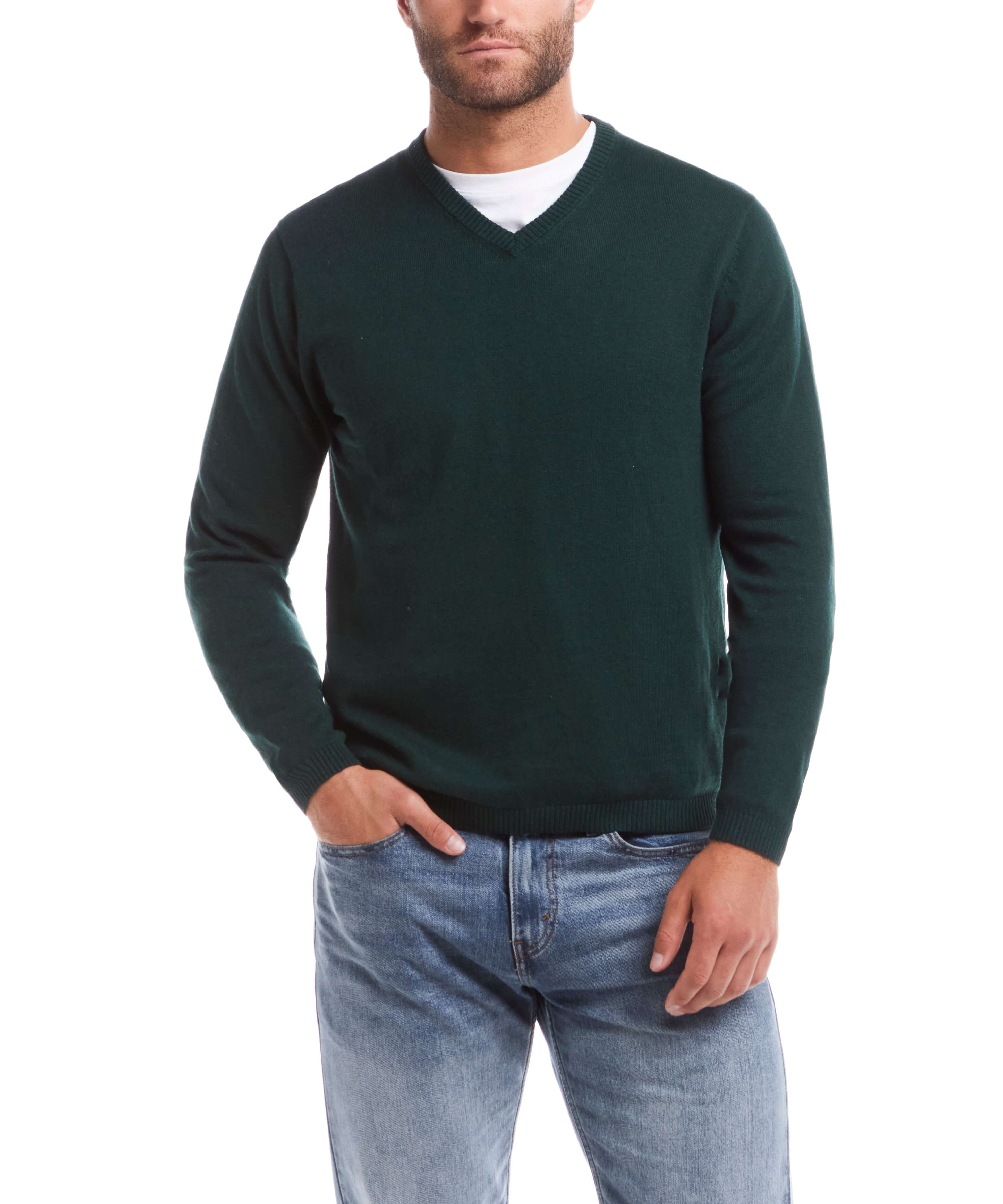 Cotton cashmere holiday v-neck sweater in pine, featuring a casual style and soft blend, modeled by a man in jeans.